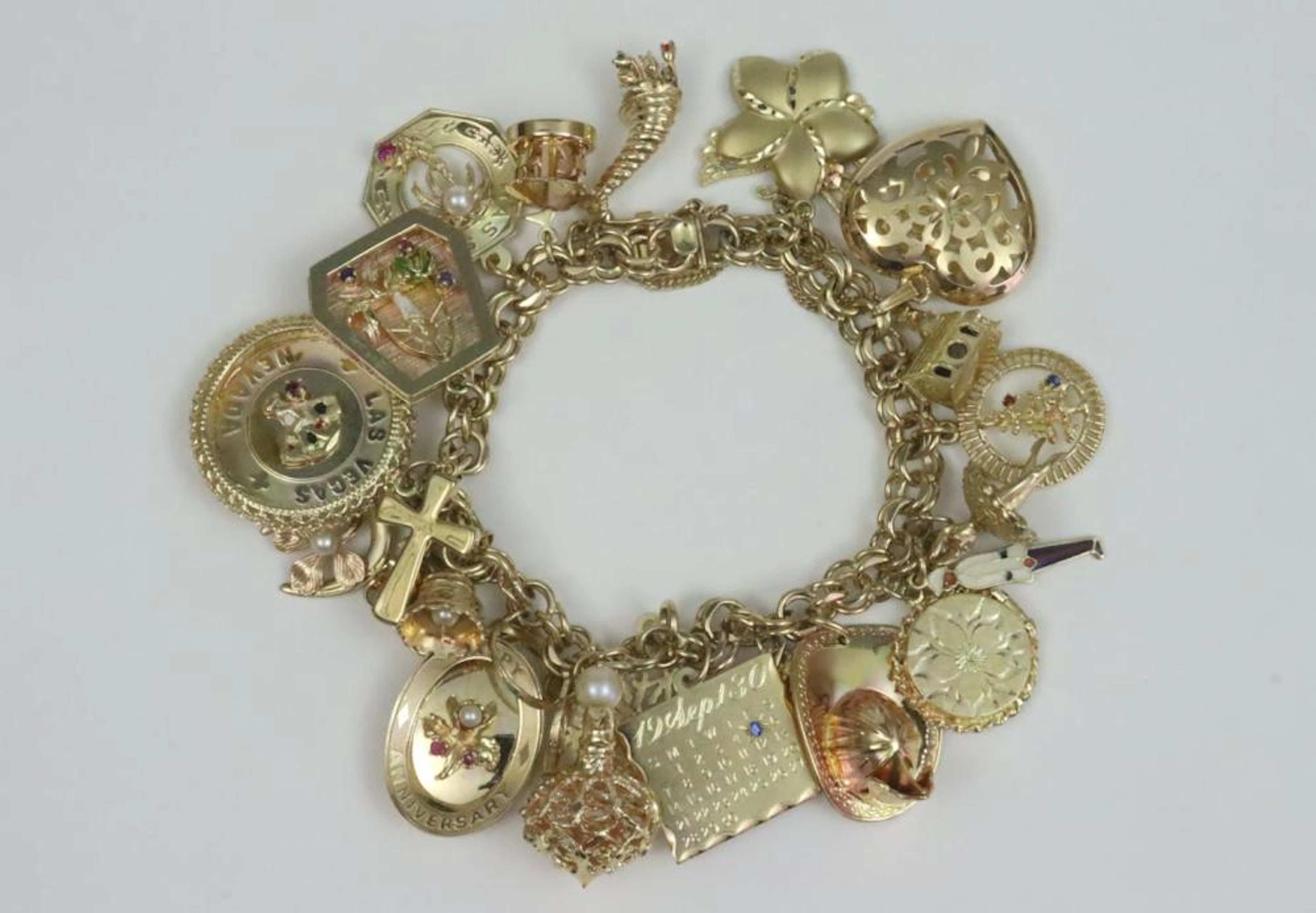 14K CHARM BRACELET WITH (25) 14K CHARMS