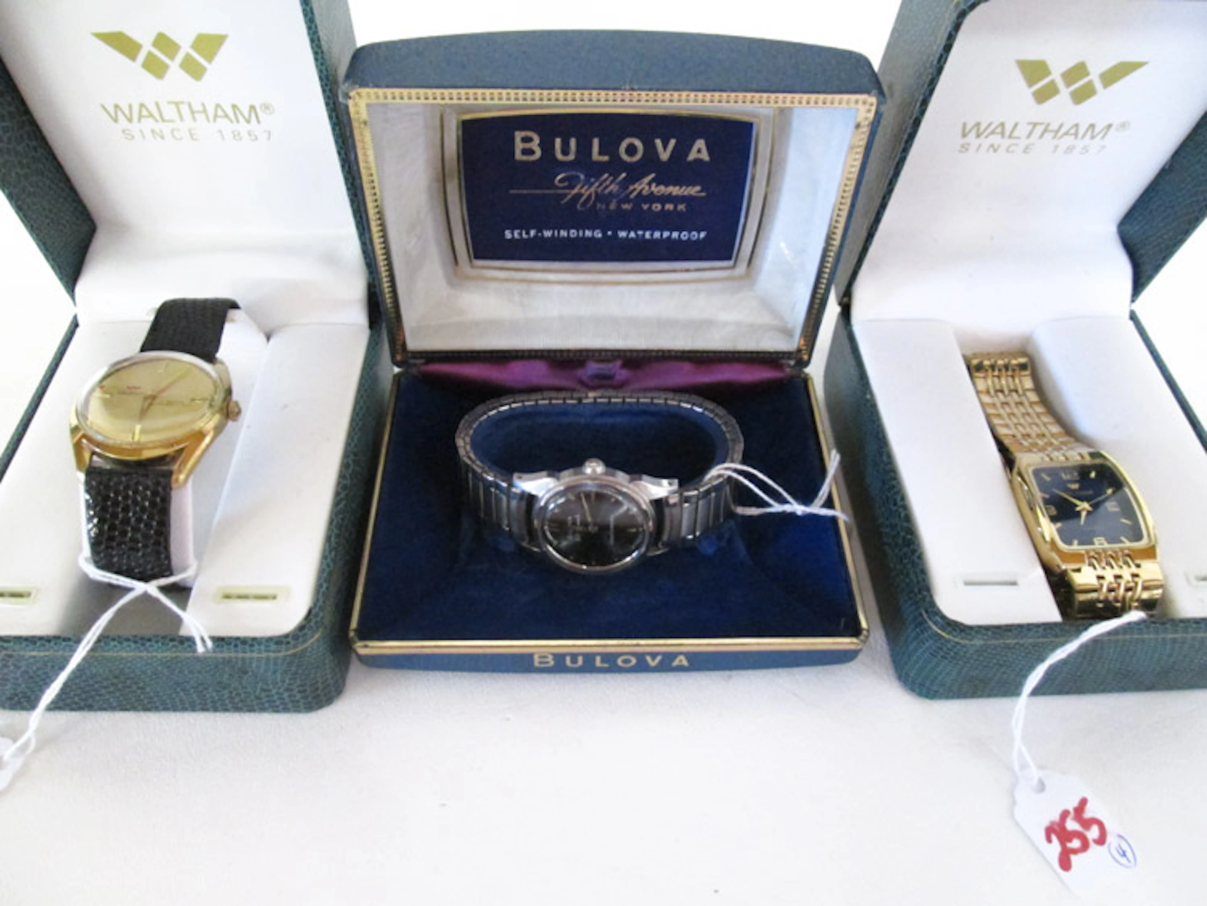 FOUR TIMEPIECES including Bulova self winding 23 j