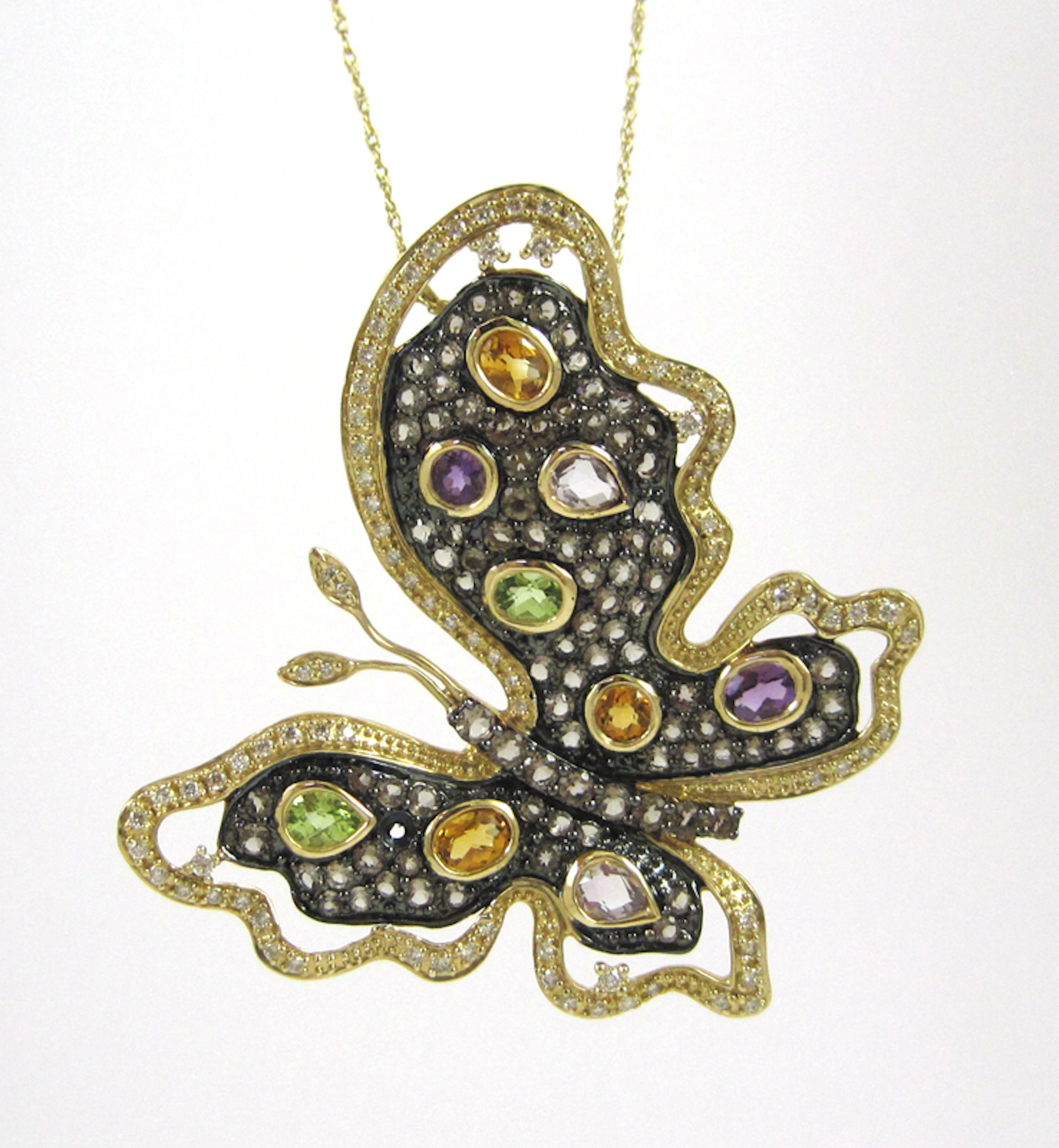LEVIAN MULTI-STONE PENDANT NECKLACE, suspended on an 18 inch 14k yellow gold chain is a large 14k yellow and blackened gold butterfly pendant set with diamonds, amethyst, peridot, citrine, rose quartz