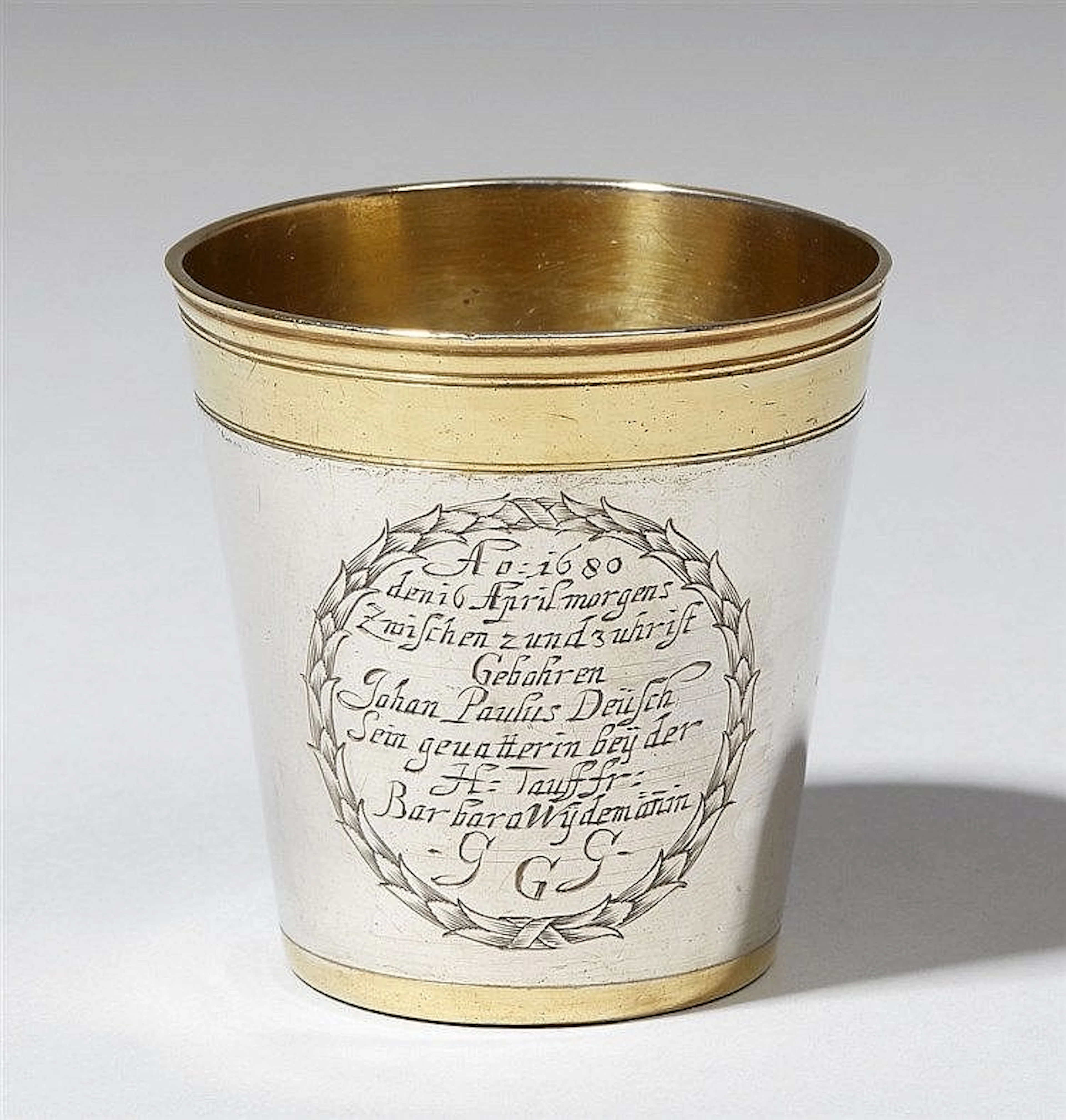 A small parcel gilt Augsburg silver christening beaker. With the engraved dedication "Johann Paulus Deusch" from his "Gevatterin bey der H: Tauff fr: Barbara Wydemann", and dated 1680. Marks of David 