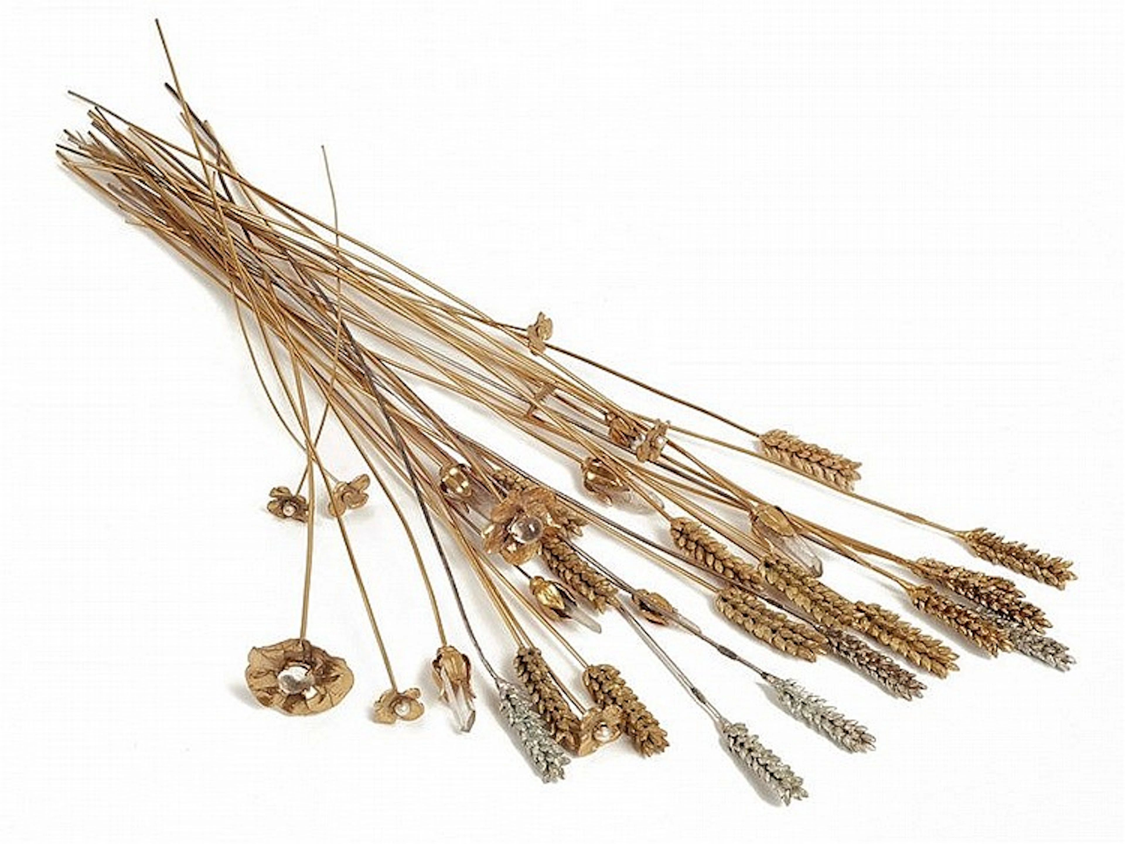 Eighteen gold ans silver plated metal ears of wheat, nine camellias and seven flowers