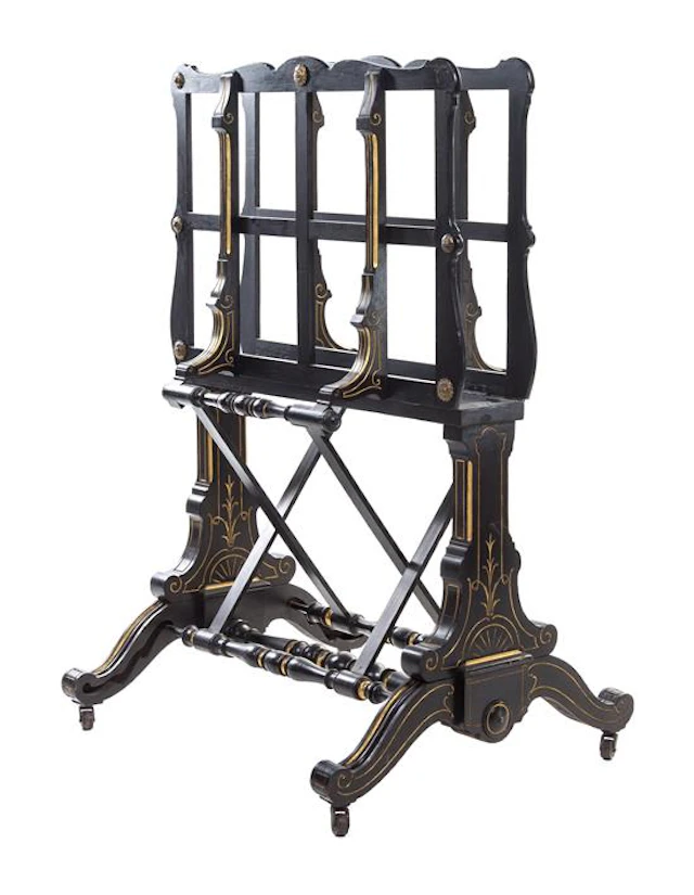 A Victorian Ebonized and Parcel Gilt Folio Stand having two adjustable