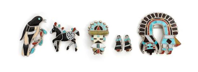 A Group of Zuni Chanel Inlaid Articles comprising four pins depicting a large Rainbow Man