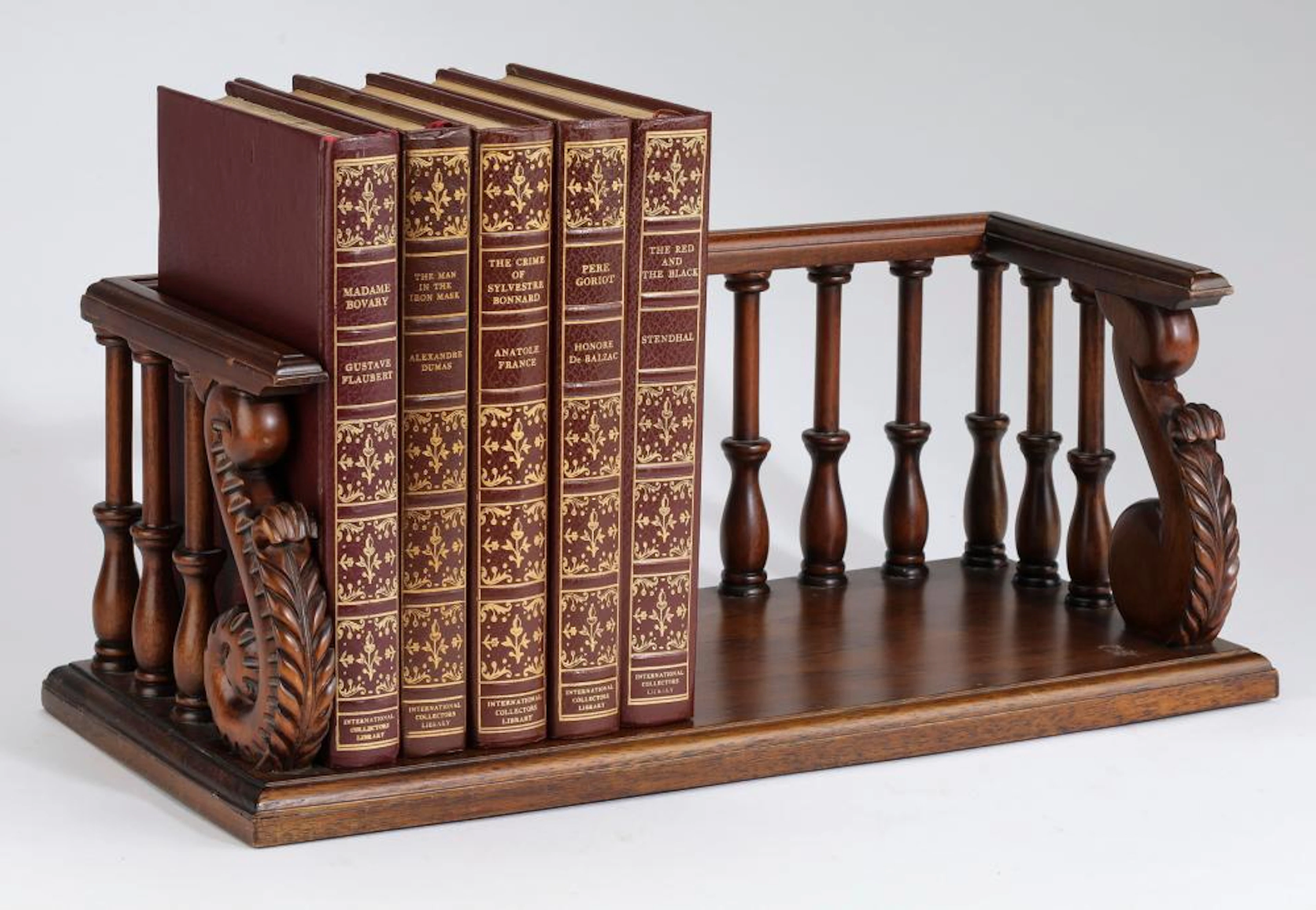(5) Leather bound novels with mahogany stand