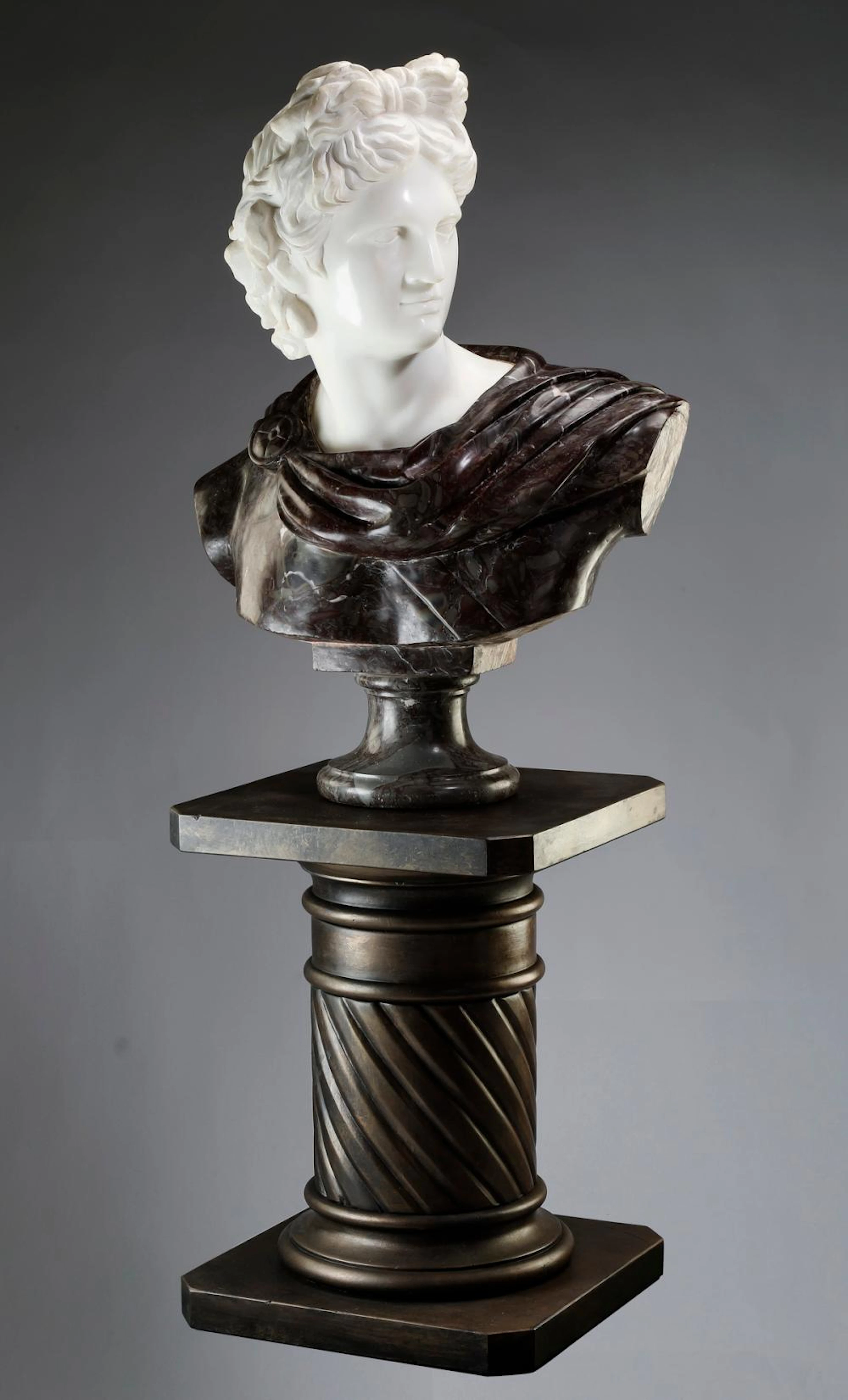 Carved marble bust of Apollo Belvedere w/ pedestal