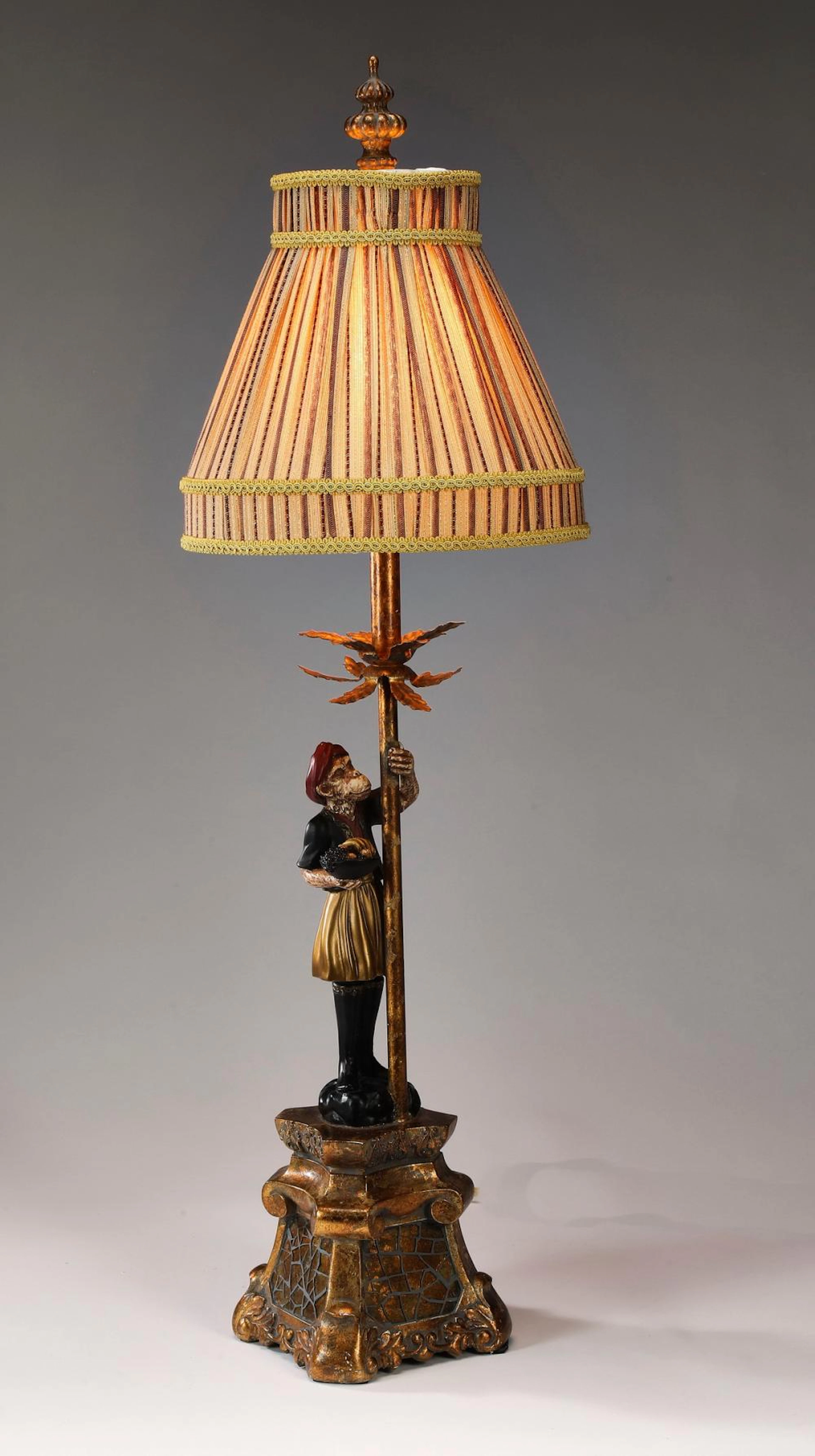 Singerie monkey table lamp with striped fabric shade