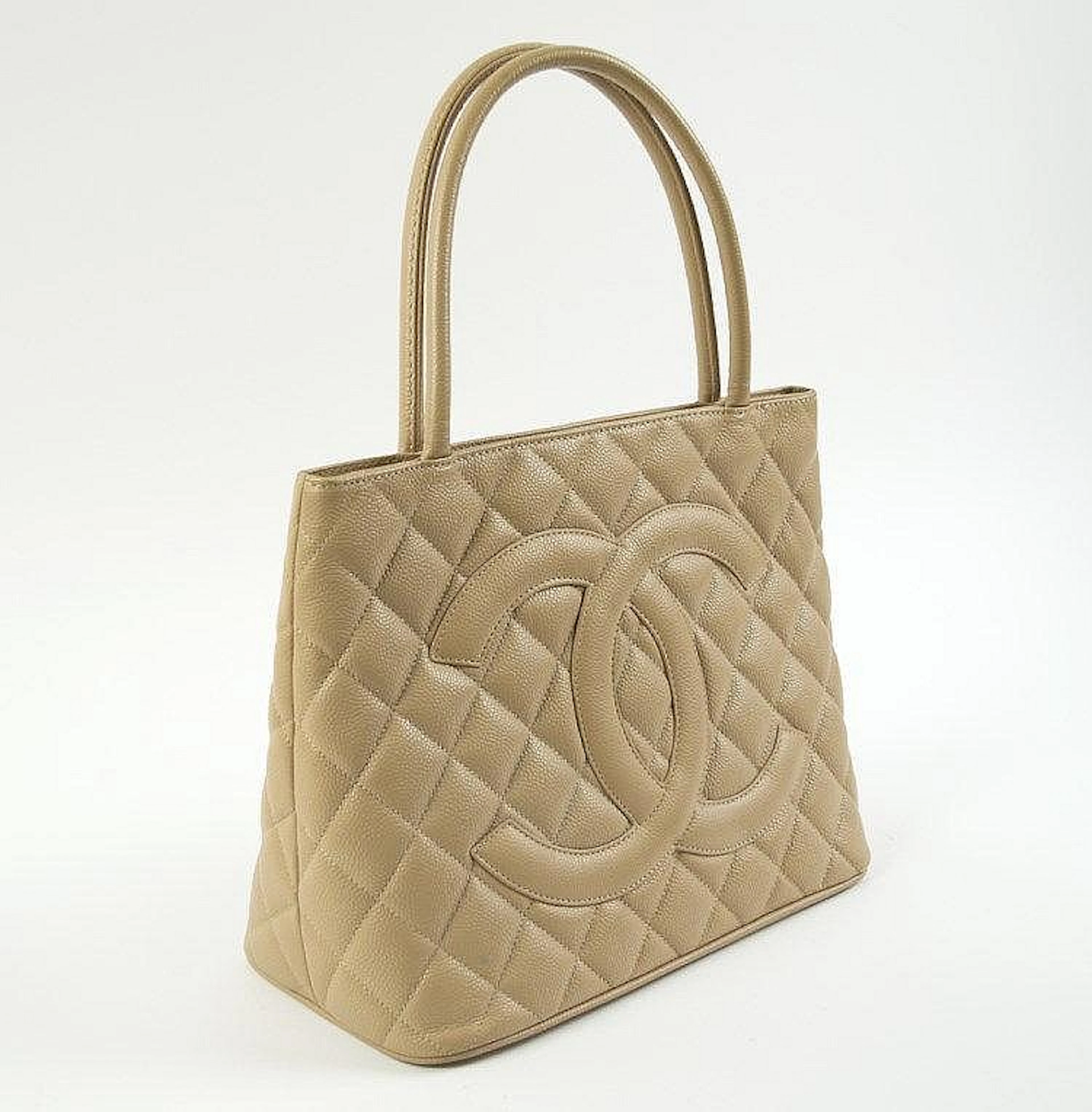 CHANEL MÈDALLION TOTE, camel quilted caviar leather with large iconic CC lo