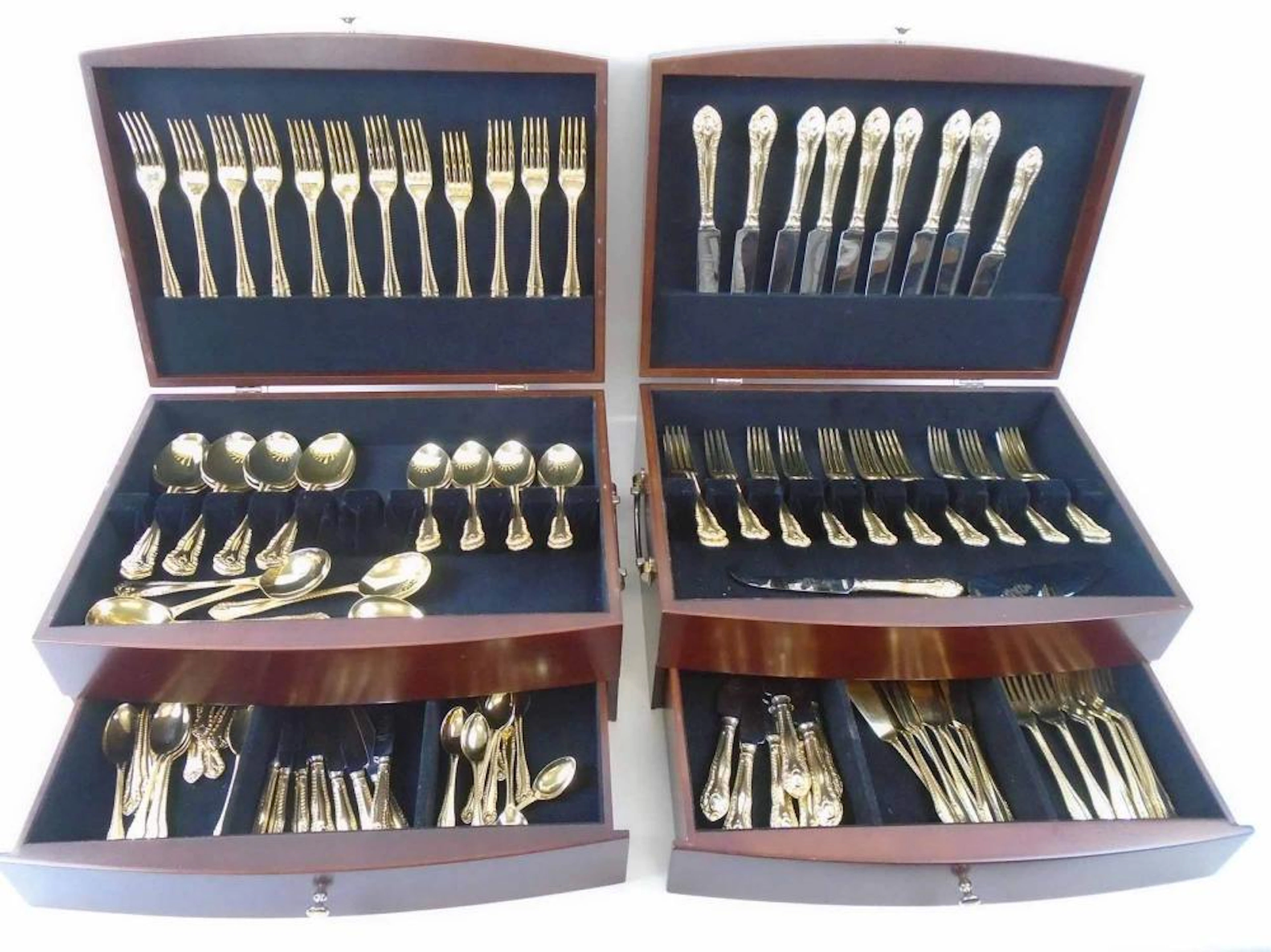 PART SUITE OF GILT HANDLED CUTLERY