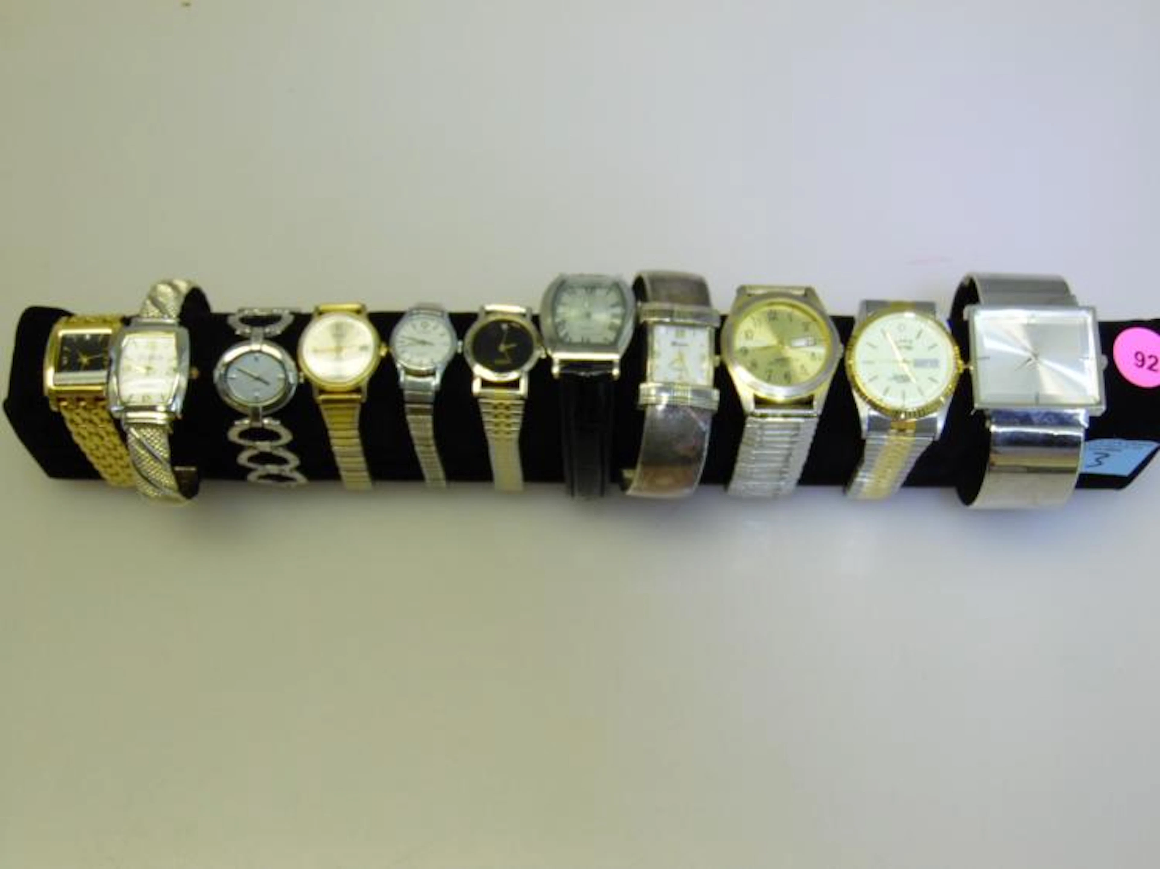 DISPLAY OF WATCHES INCLUDING ALDO, GENEVA, TIMEX, STUDIO AND MORE