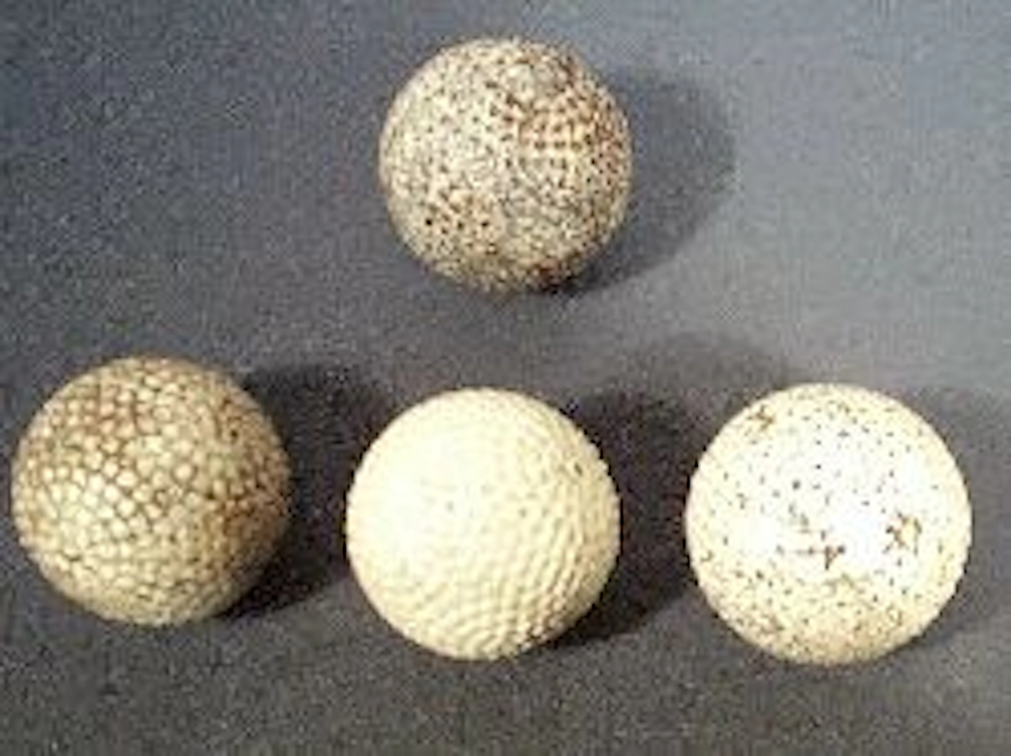 Four bramble golf balls,, 'The Resilient', a green dot 'Heavy Colonel', a 'Barnton Special' and a Woodsize patent, all lacking paint