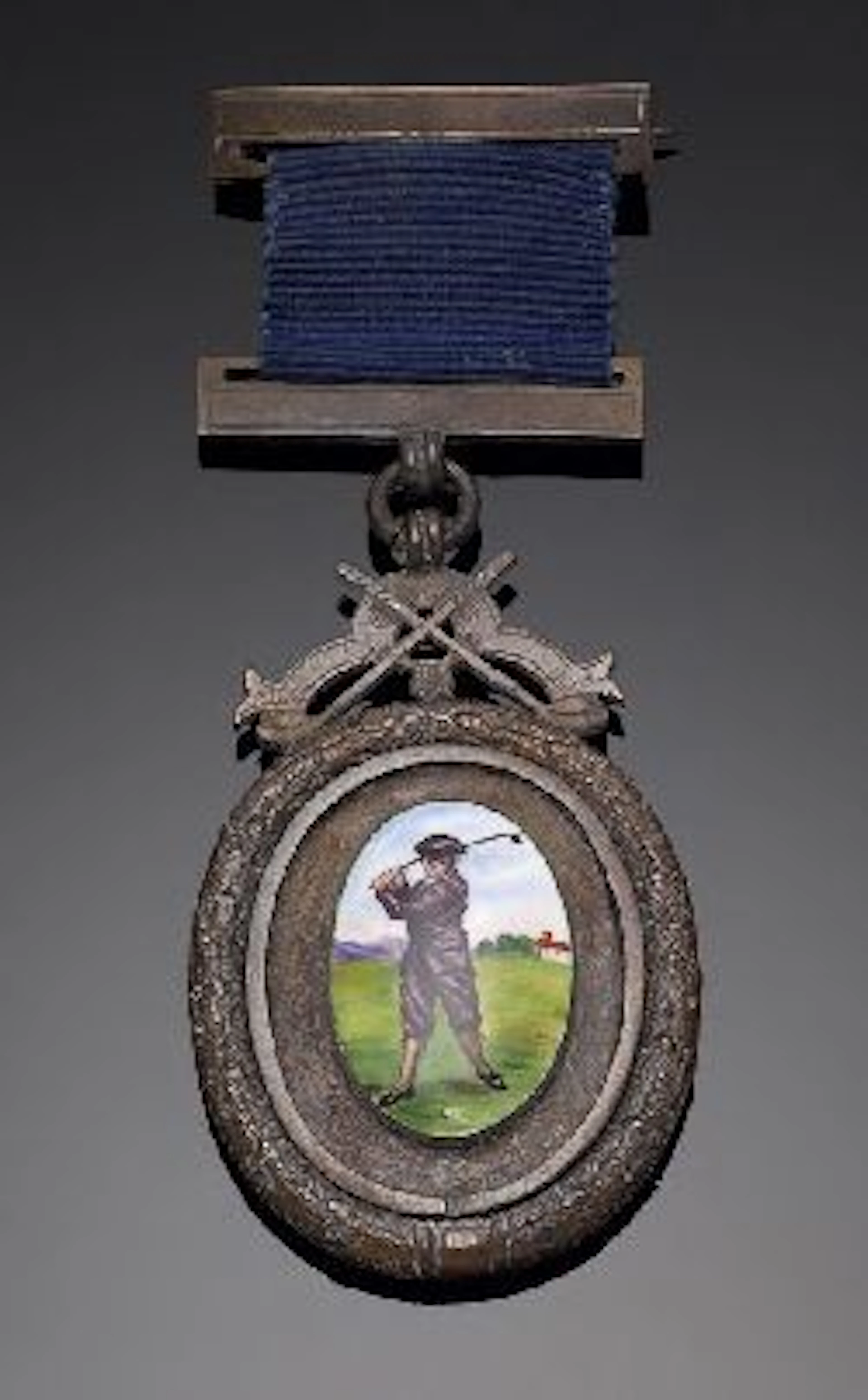 St. Nicholas Golf Club, Prestwick, a bronze and enamel medal,, the obverse; centrally with an oval enamelled panel, depicting a golfer...
