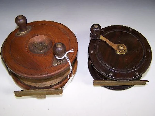 An attractive Victorian 4 1/4 in (10.8 cm) coromandel and brass, salmon fly reel,, smooth brass foot, brass crank winding arm with...