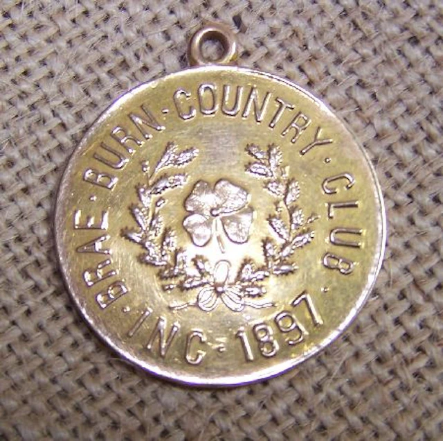 A Brae Burn Country Club yellow metal golfing medal,, the obverse with the club crest, the reverse inscribed 'Presented to Miss K....