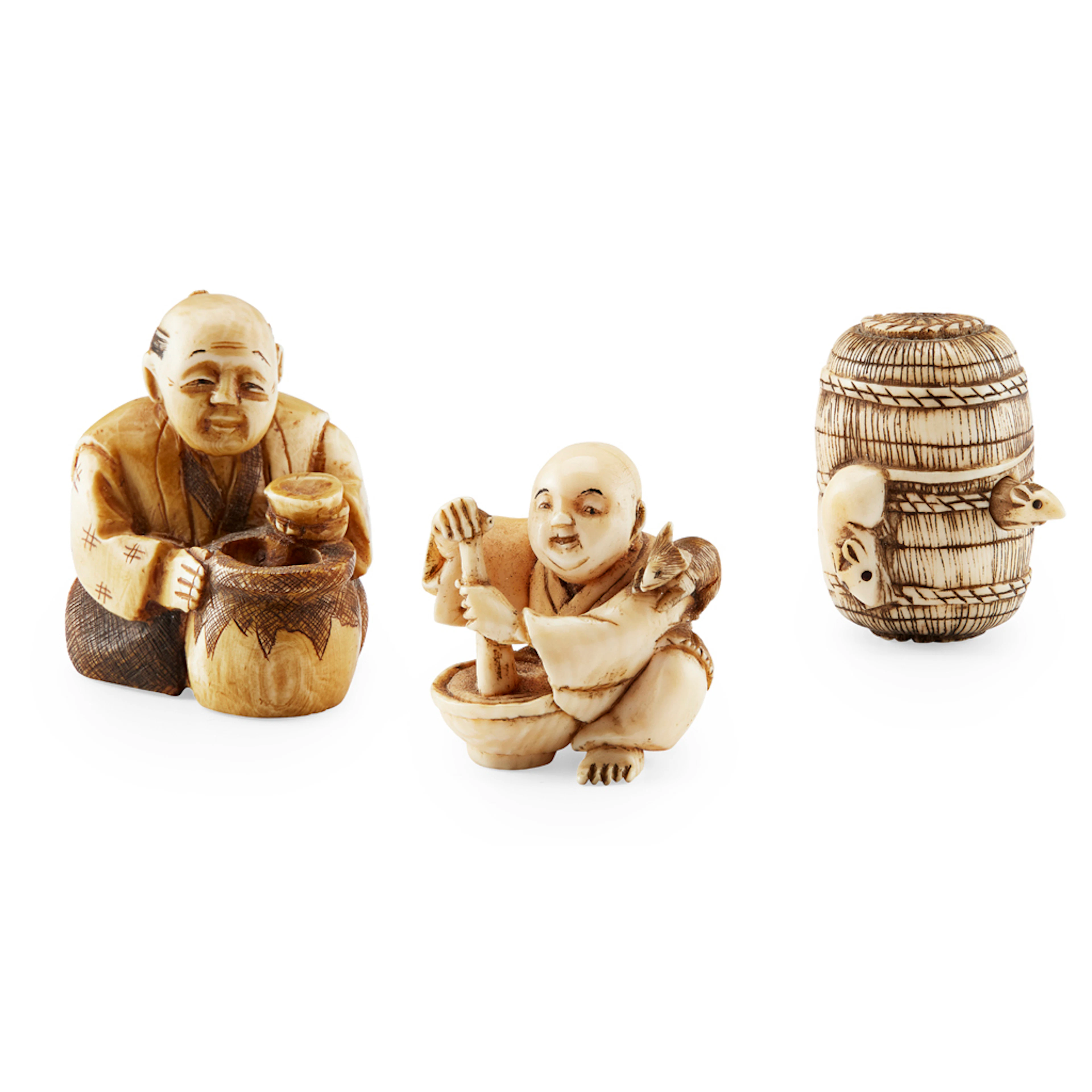 YTHREE IVORY NETSUKE, the first a karakuri netsuke of two rats eating from a bale of hay, the second a boy at work with a mortar and...