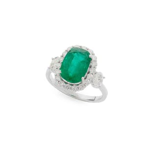 An emerald and diamond cluster ring, An emerald and diamond cluster ring