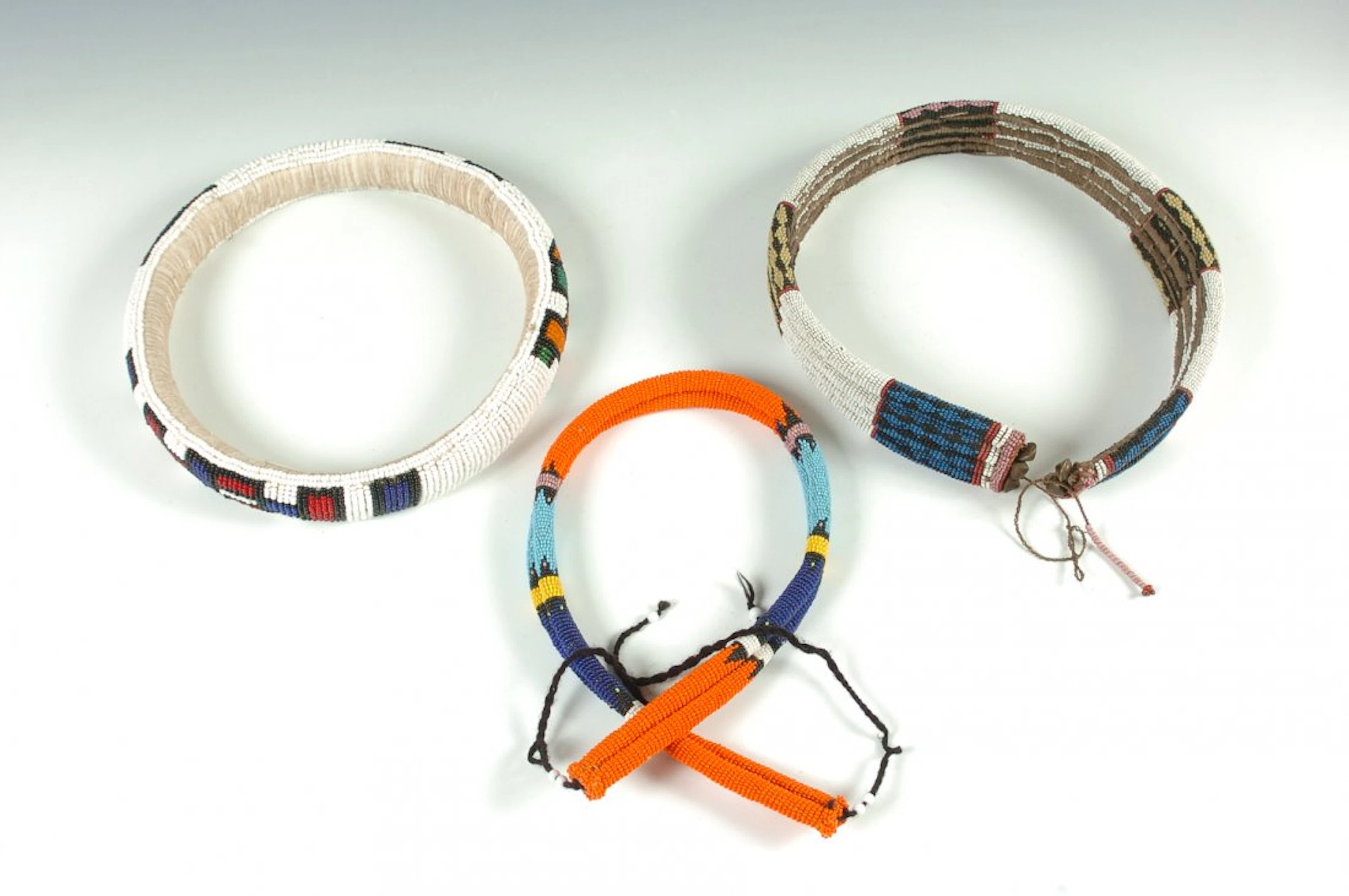 TWO ZULU BEADED BELTS & A NDEBELE BEADED NECK RING