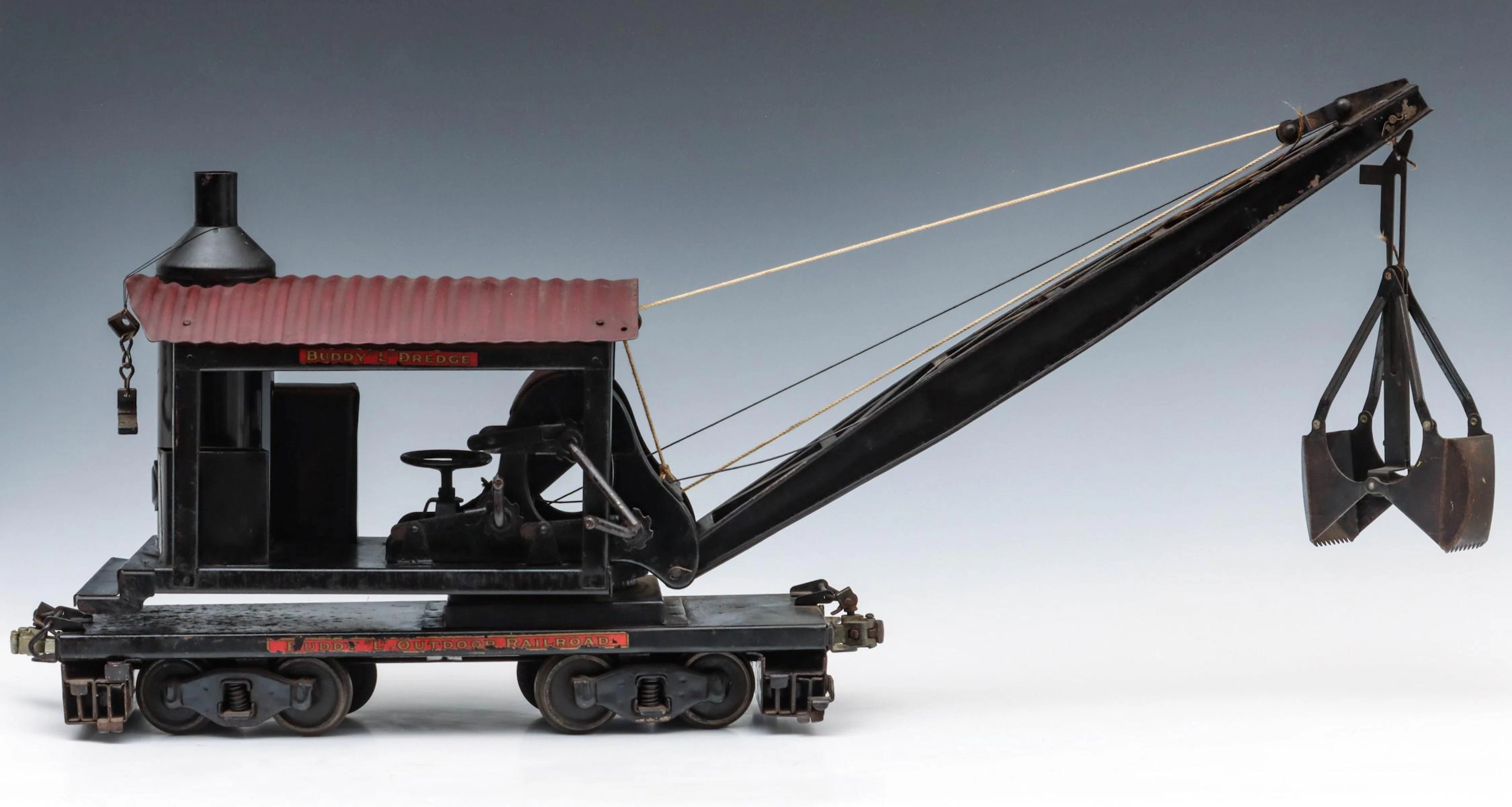 A BUDDY L PRESSED STEEL WRECKING CRANE RAIL CAR