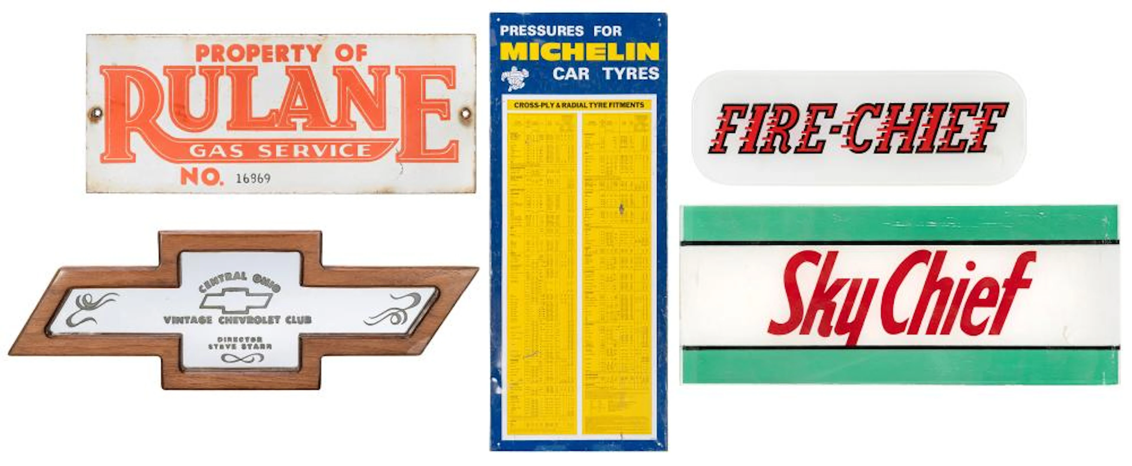 Group of 4 automotive-related signs. [V.p., 1940s-1970s]. I...