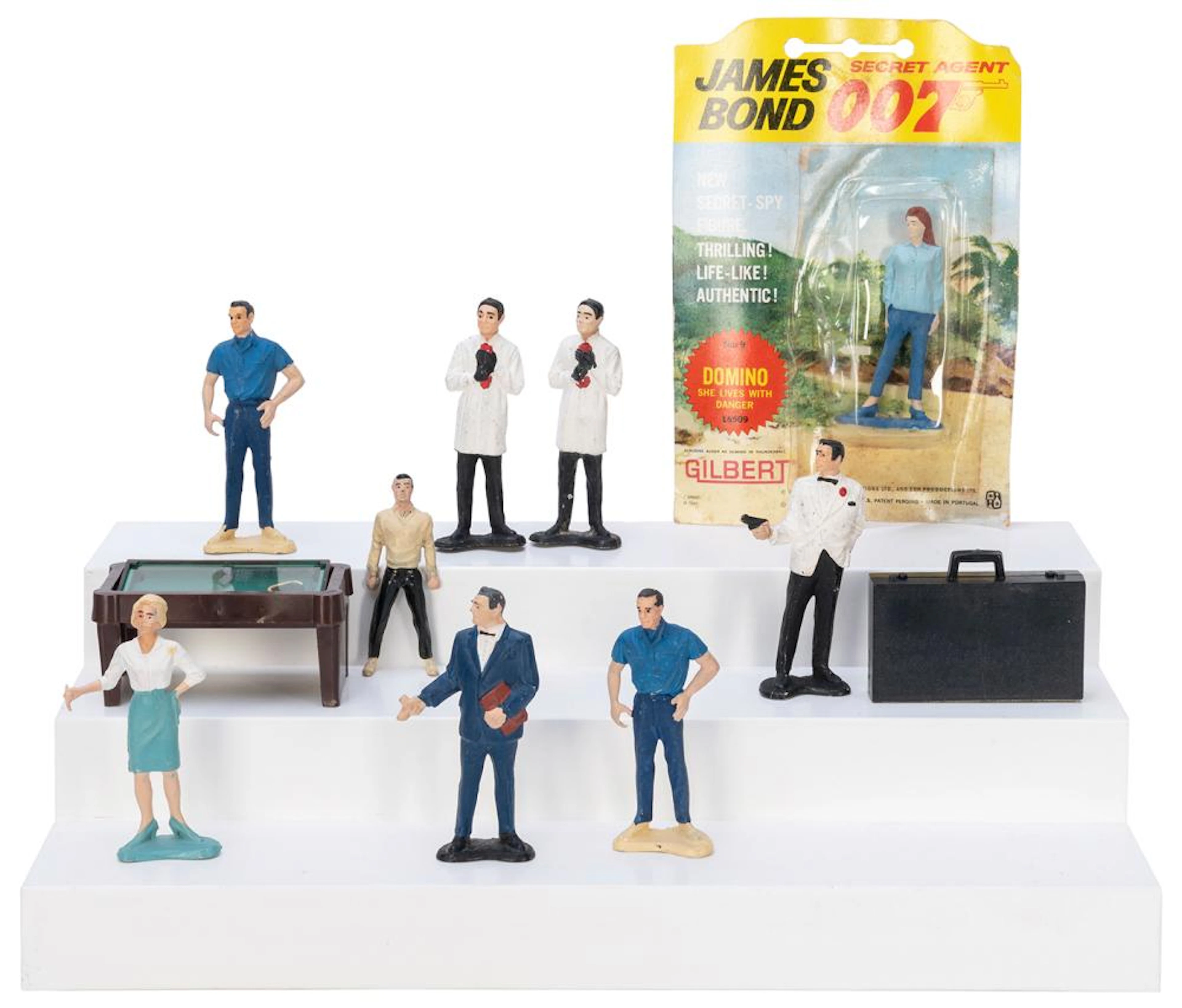 Group of 10 painted James Bond figurines or accessories in ...