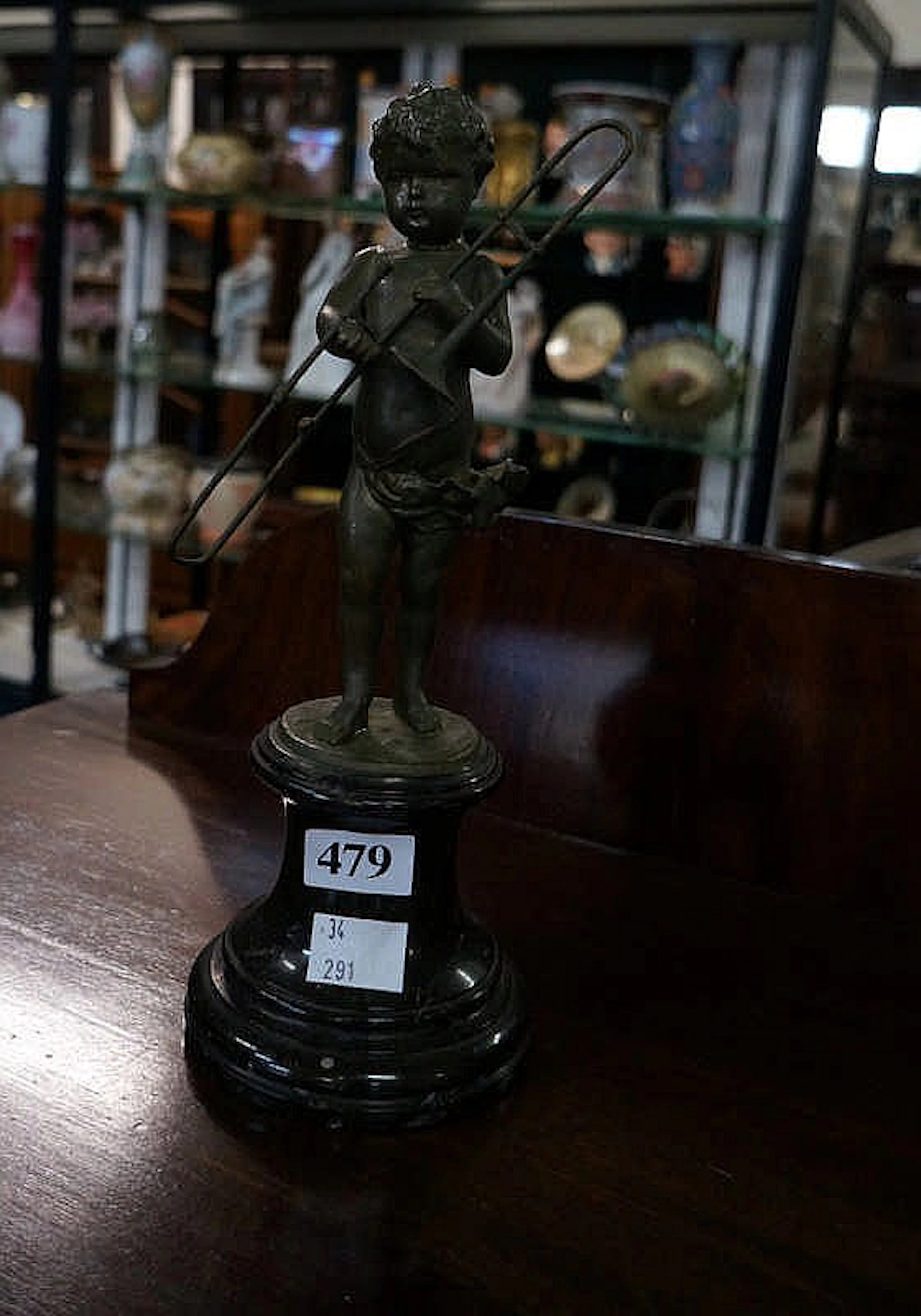 Antique spelter 24 cm figure of cherub with trombone