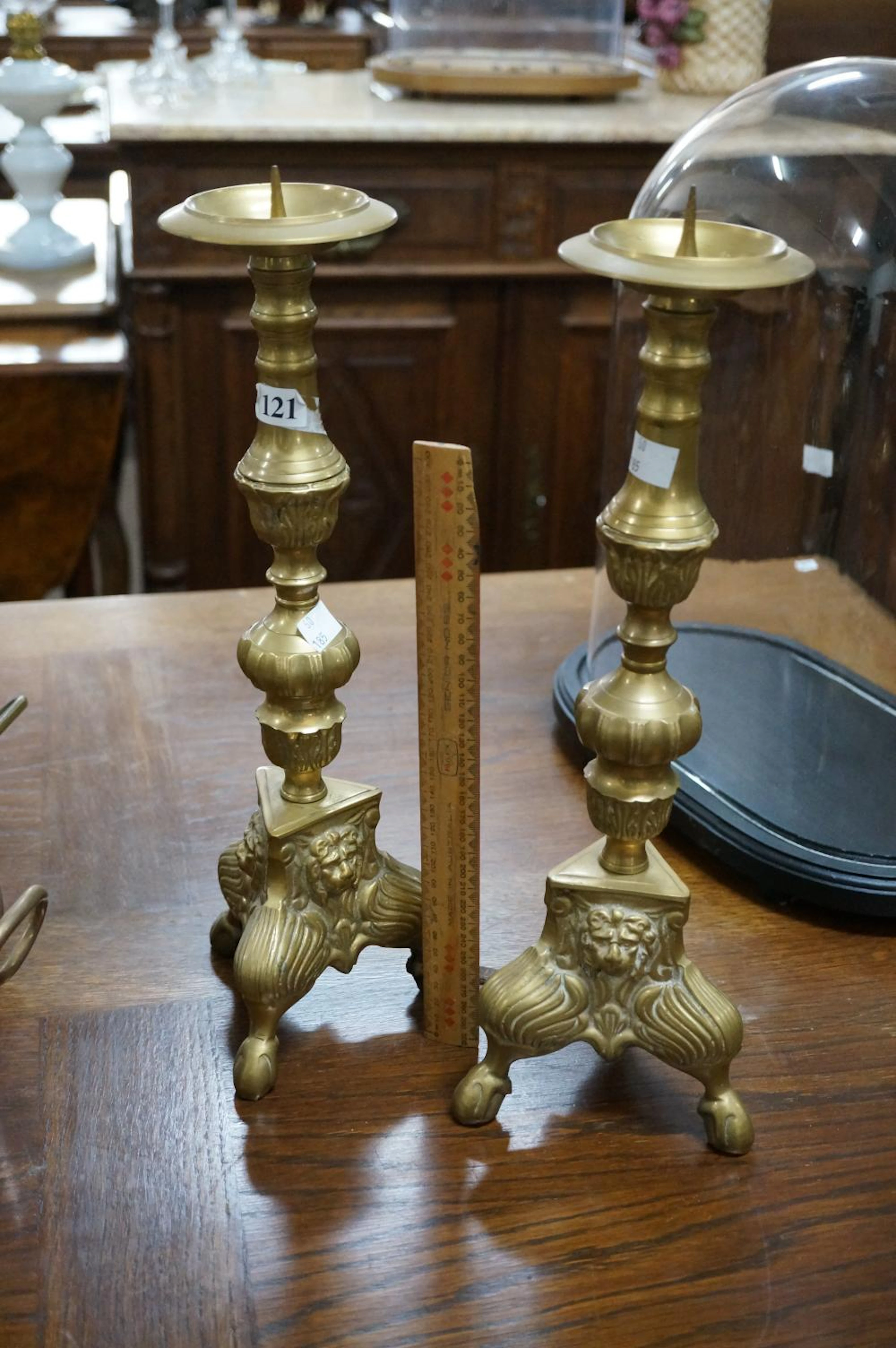 Pr tall brass candelsticks on lion mask head base, 43 cm high