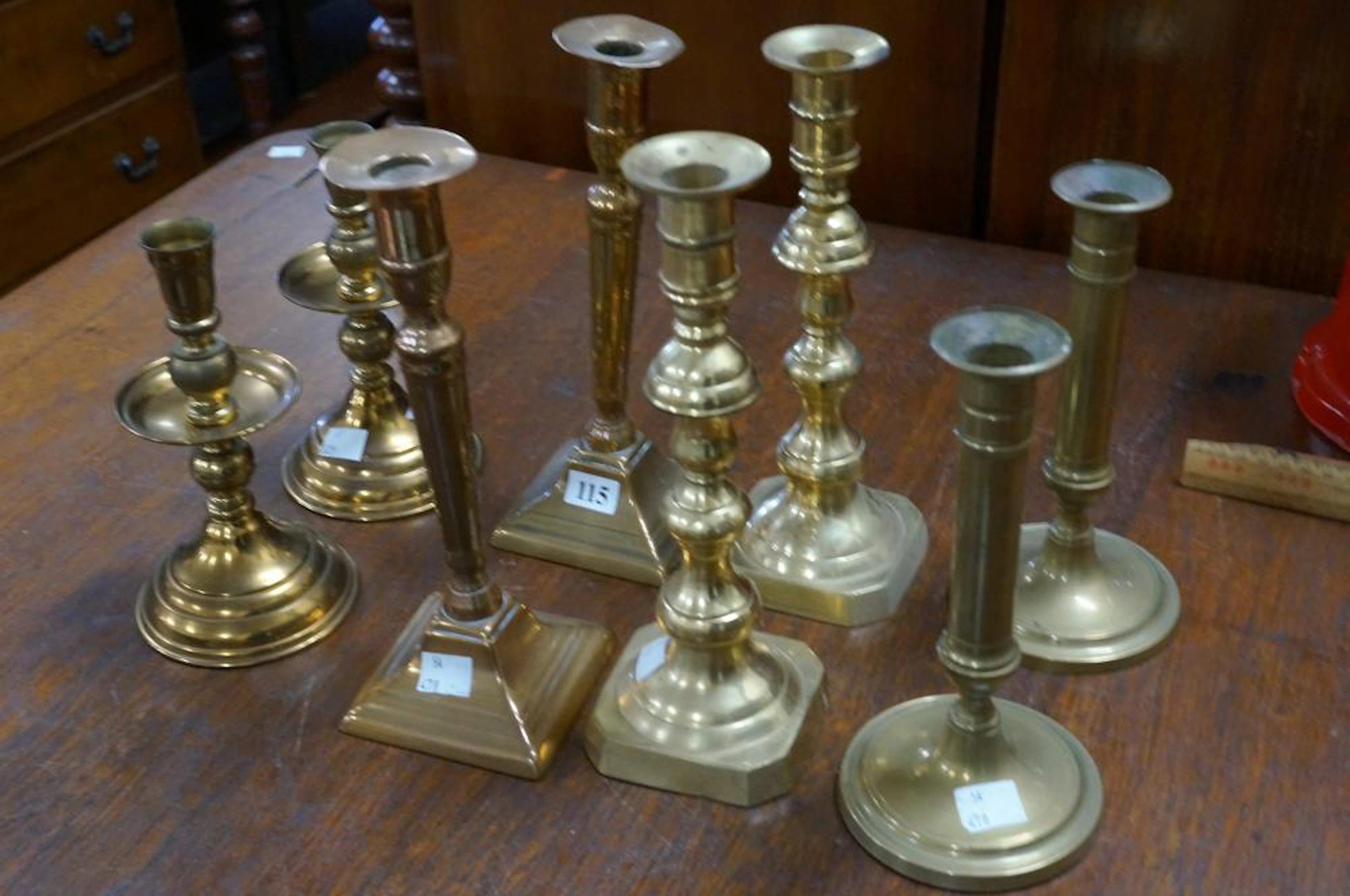 4 prs of antique brass candelsticks