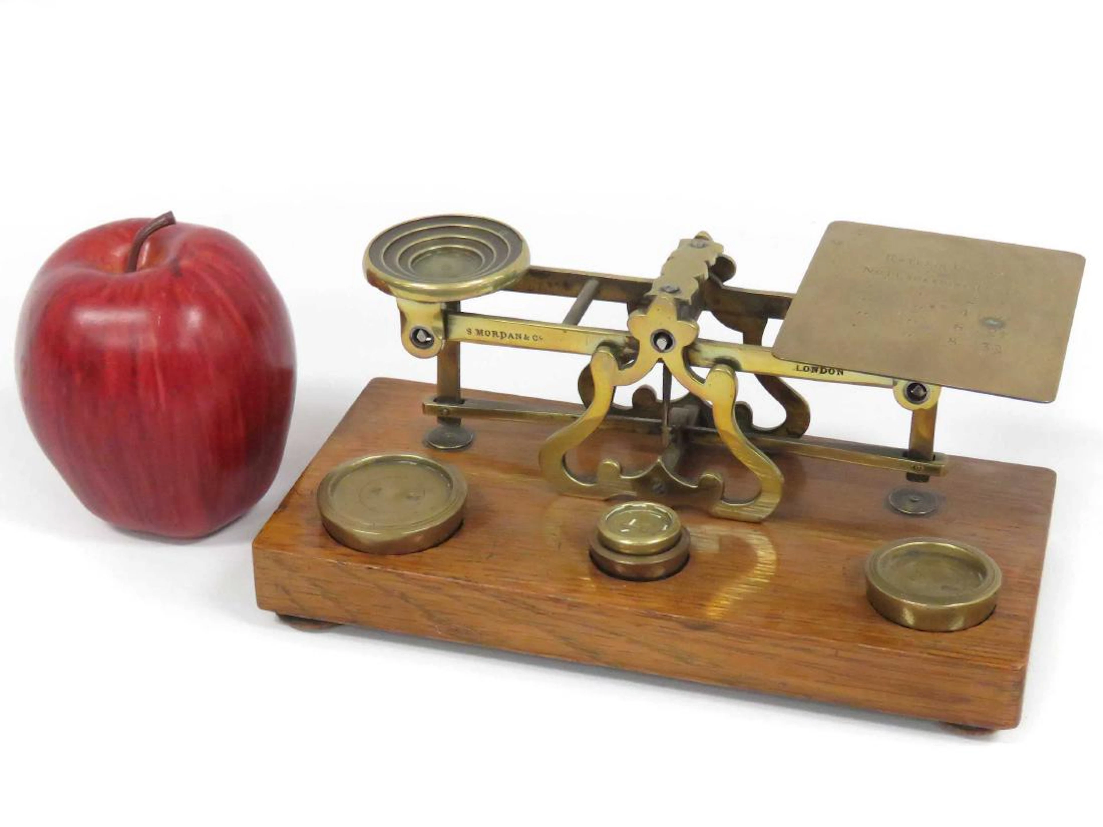 Vintage brass/oak postal scale with weights, signed s.
