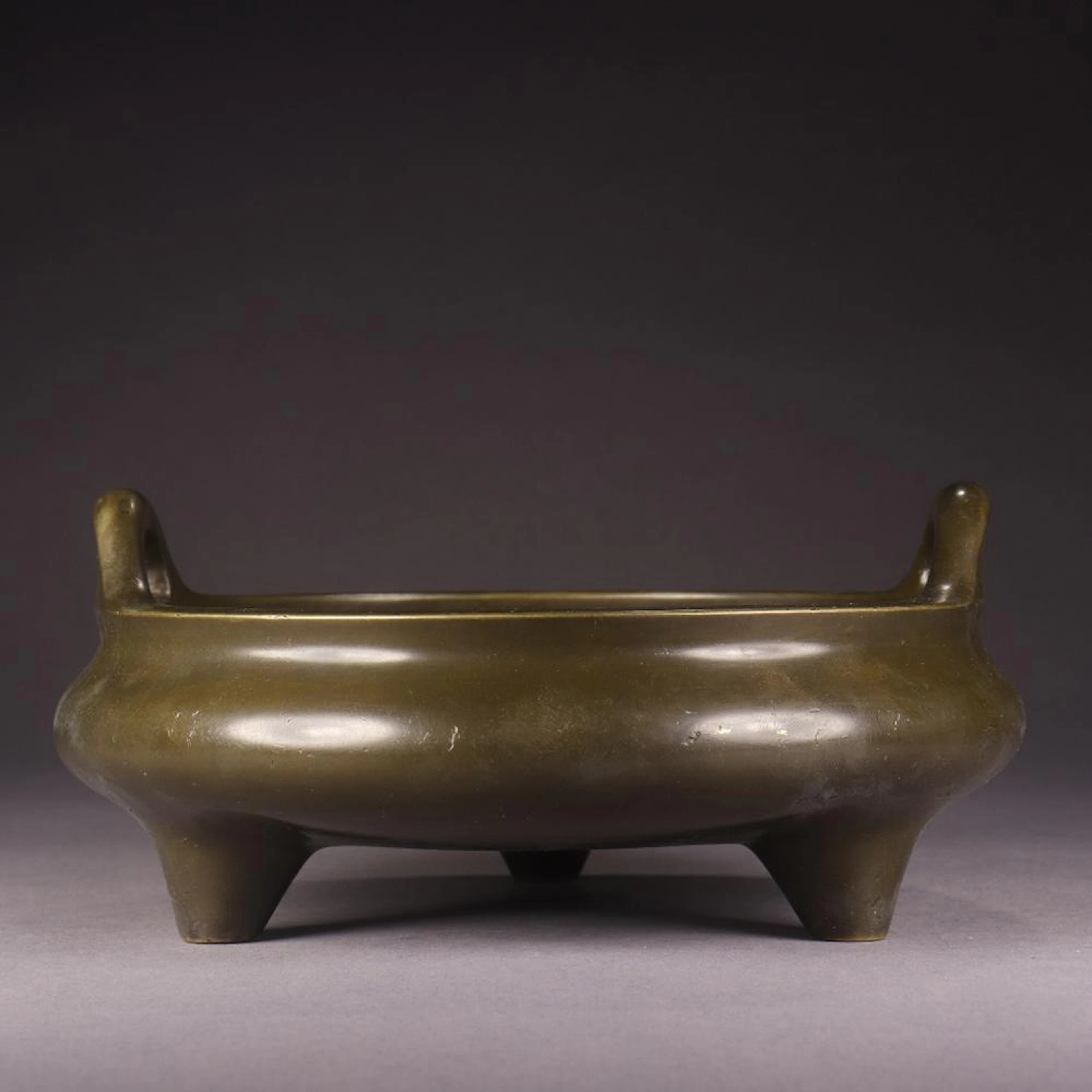 A CHINESE TRIPOD COPPER INCENSE BURNER
