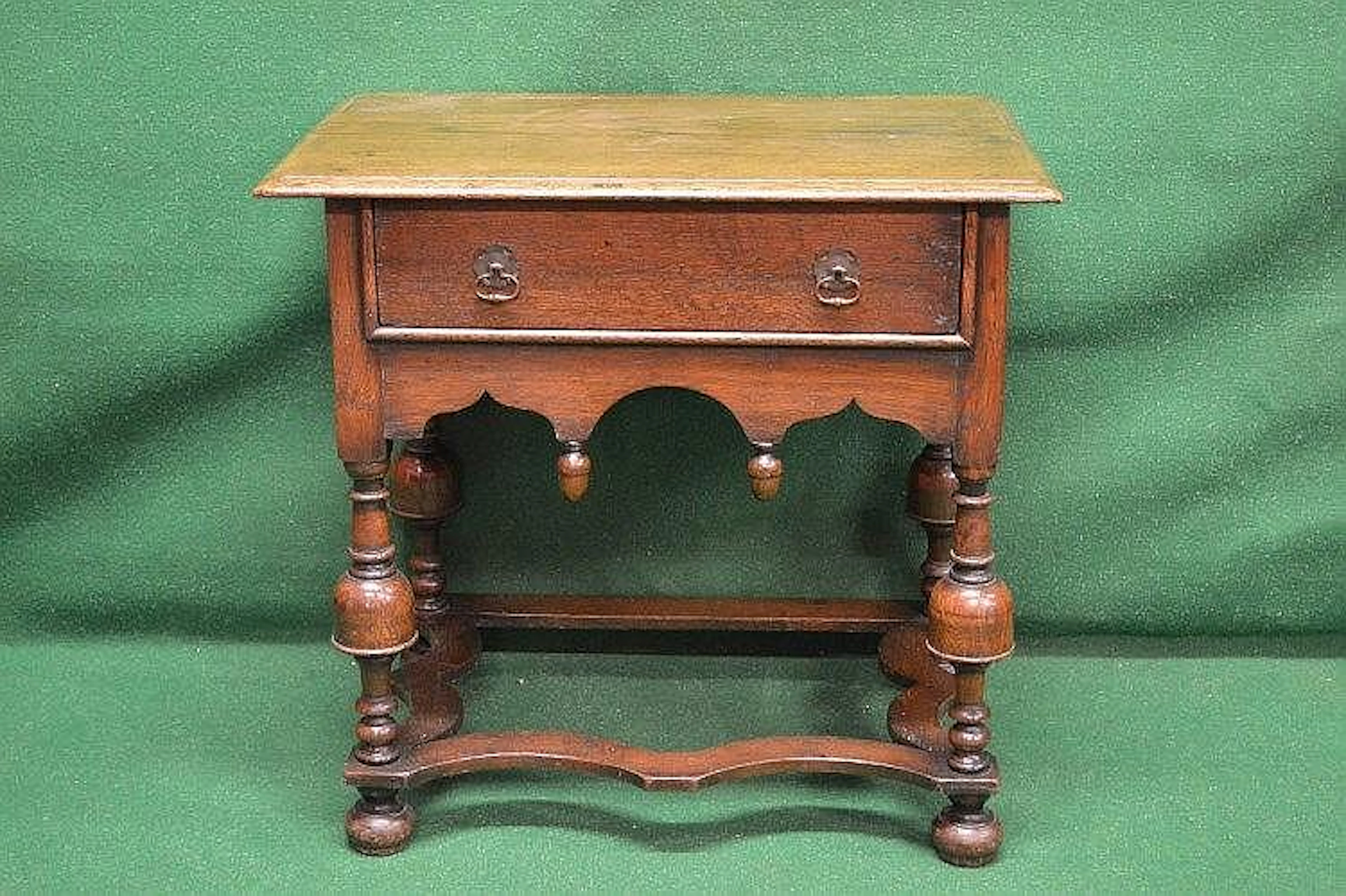Oak single drawer side table the top having moulded edge...