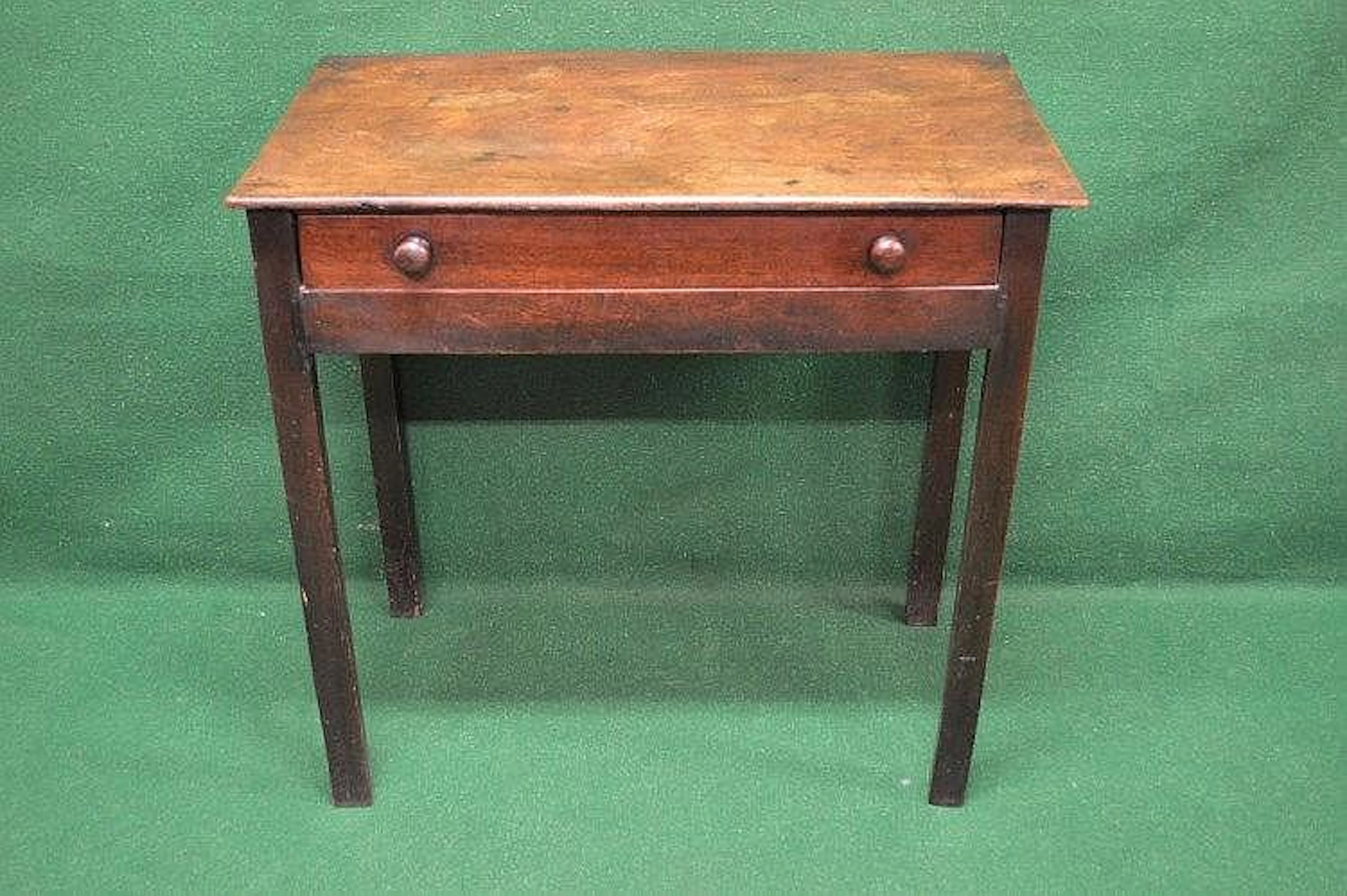 A mahogany side table having single long drawer with turned knob handles