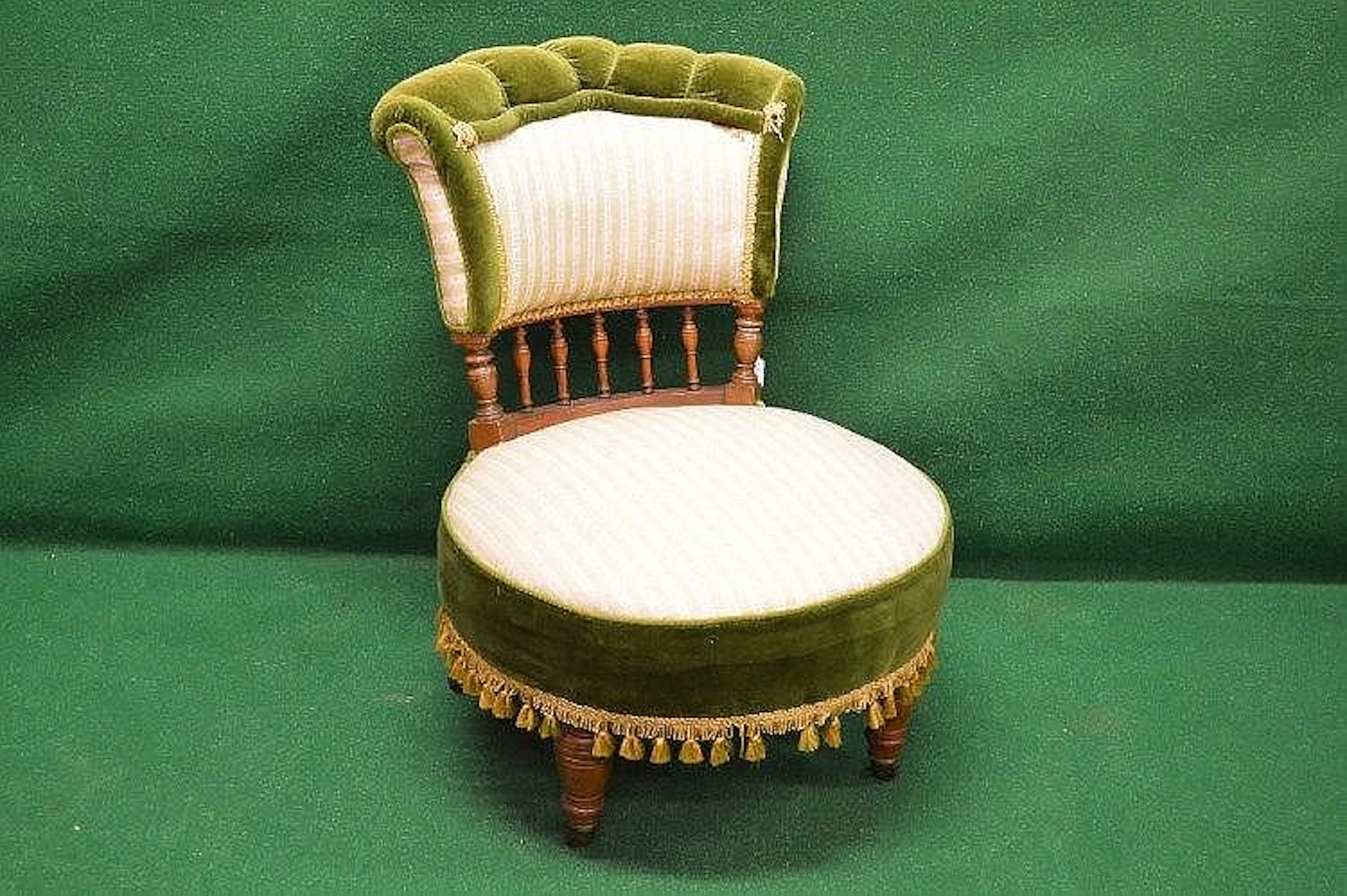 An Edwardian nursing chair having upholstered back...
