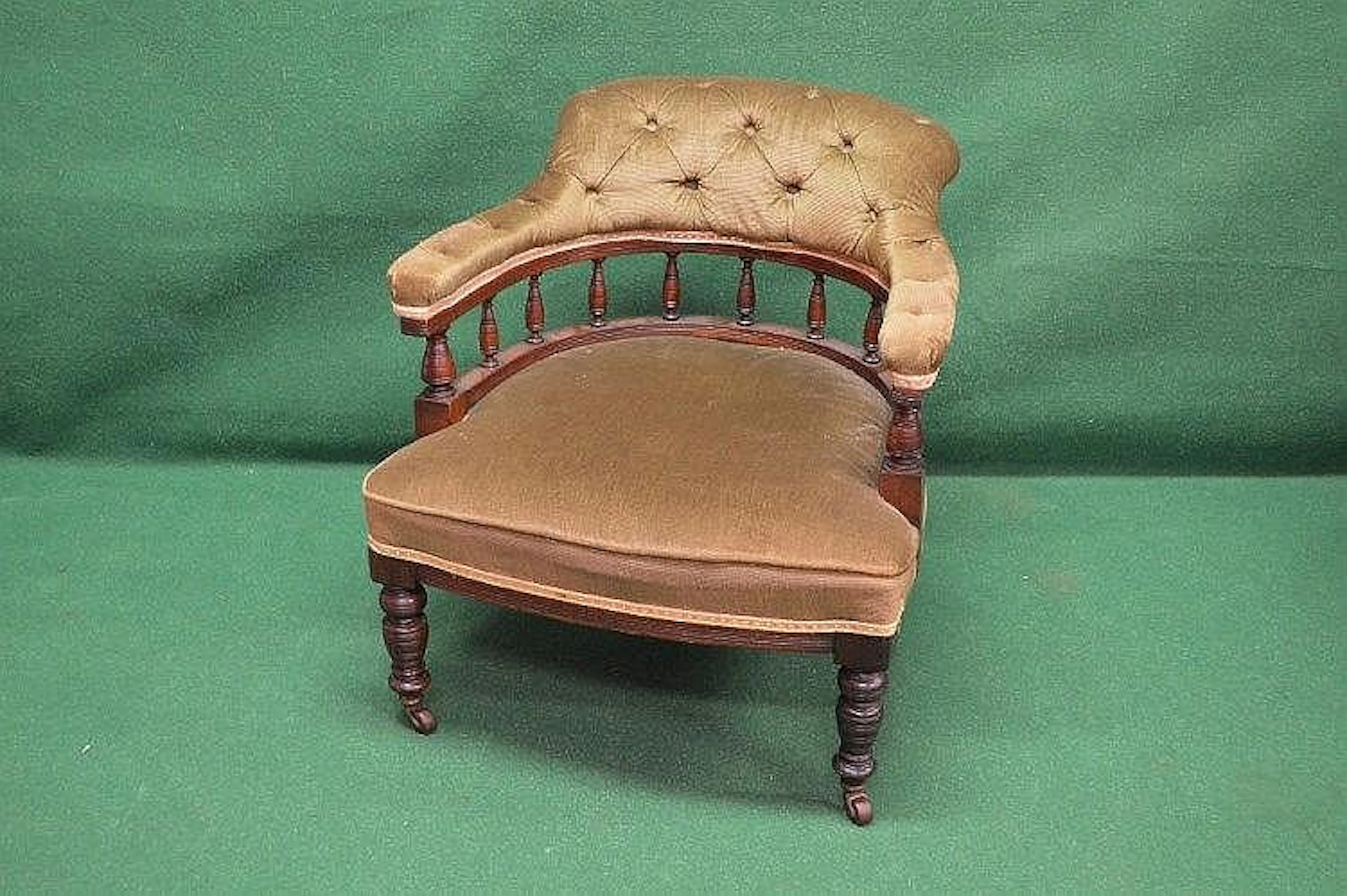Edwardian tub armchair having buttoned back and arms...