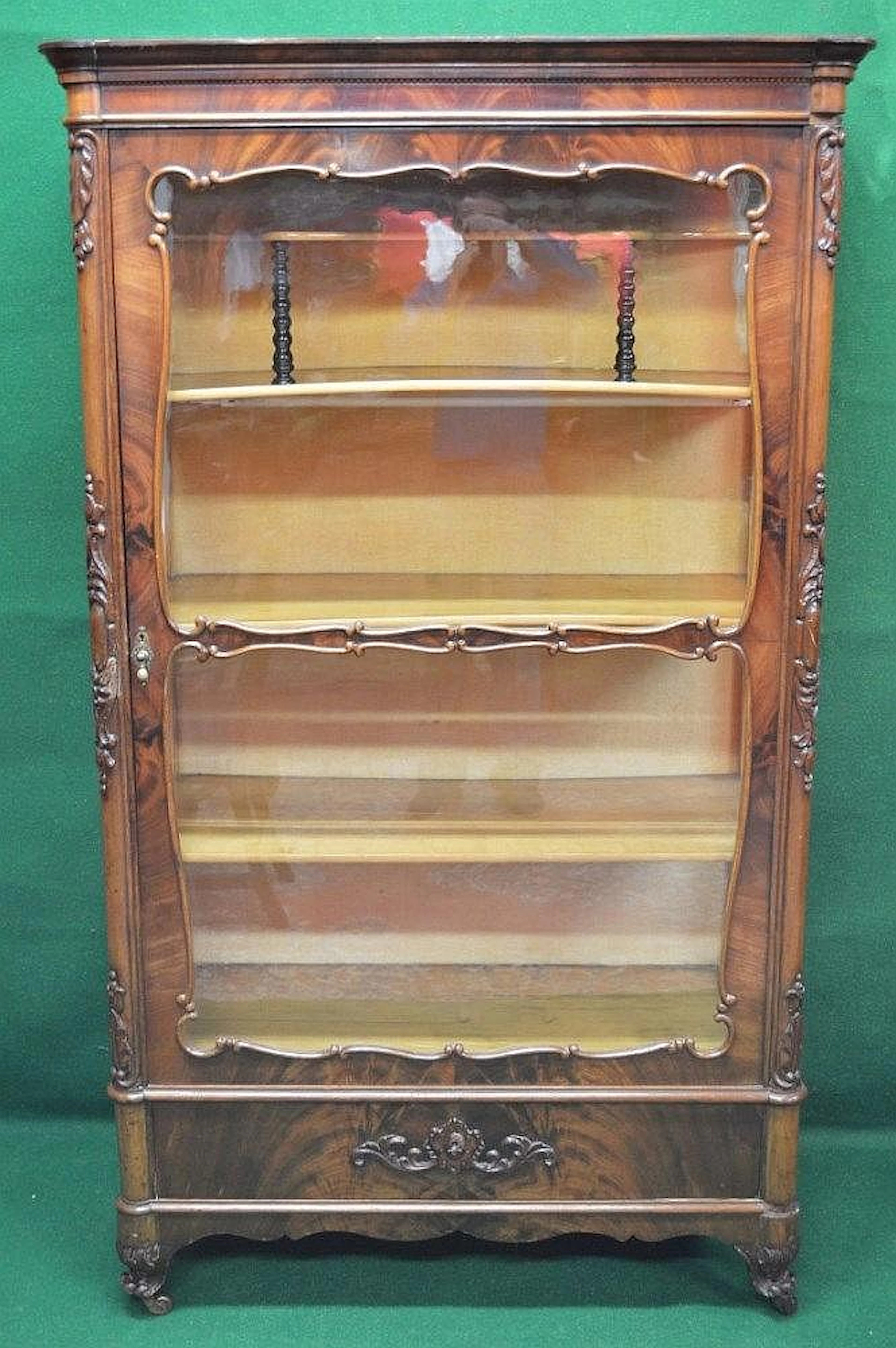 A mahogany display cabinet having glazed sides and door...