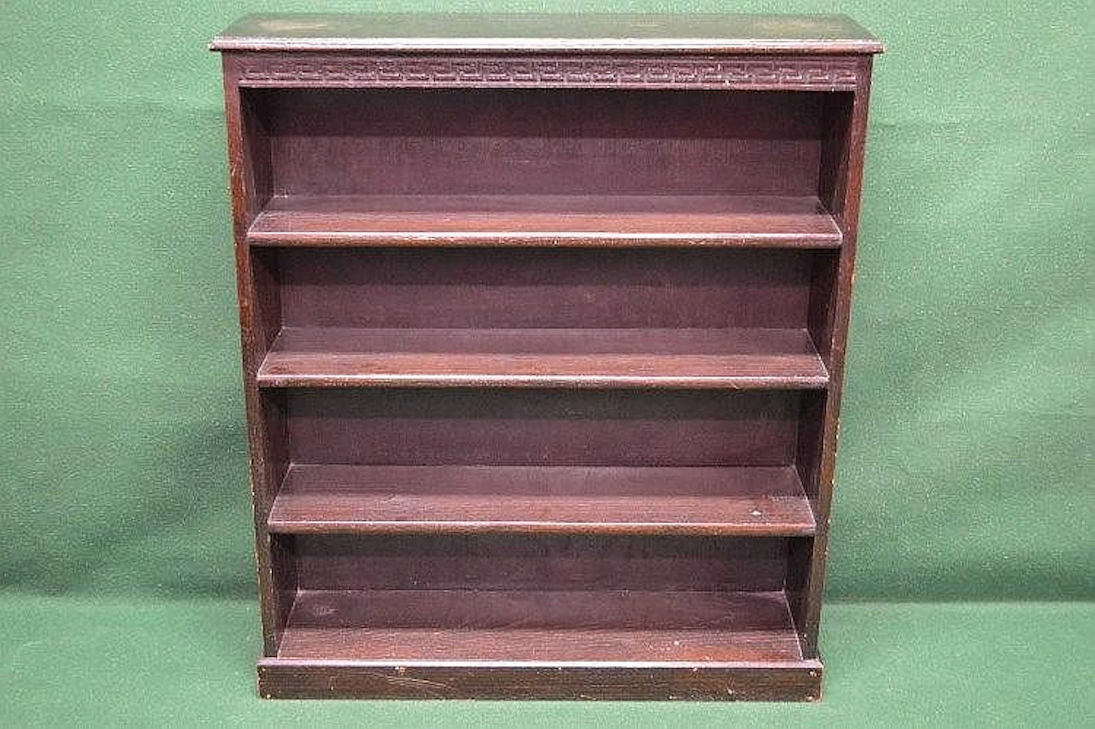 Oak bookshelves with Greek Key carved decoration and three fixed shelves