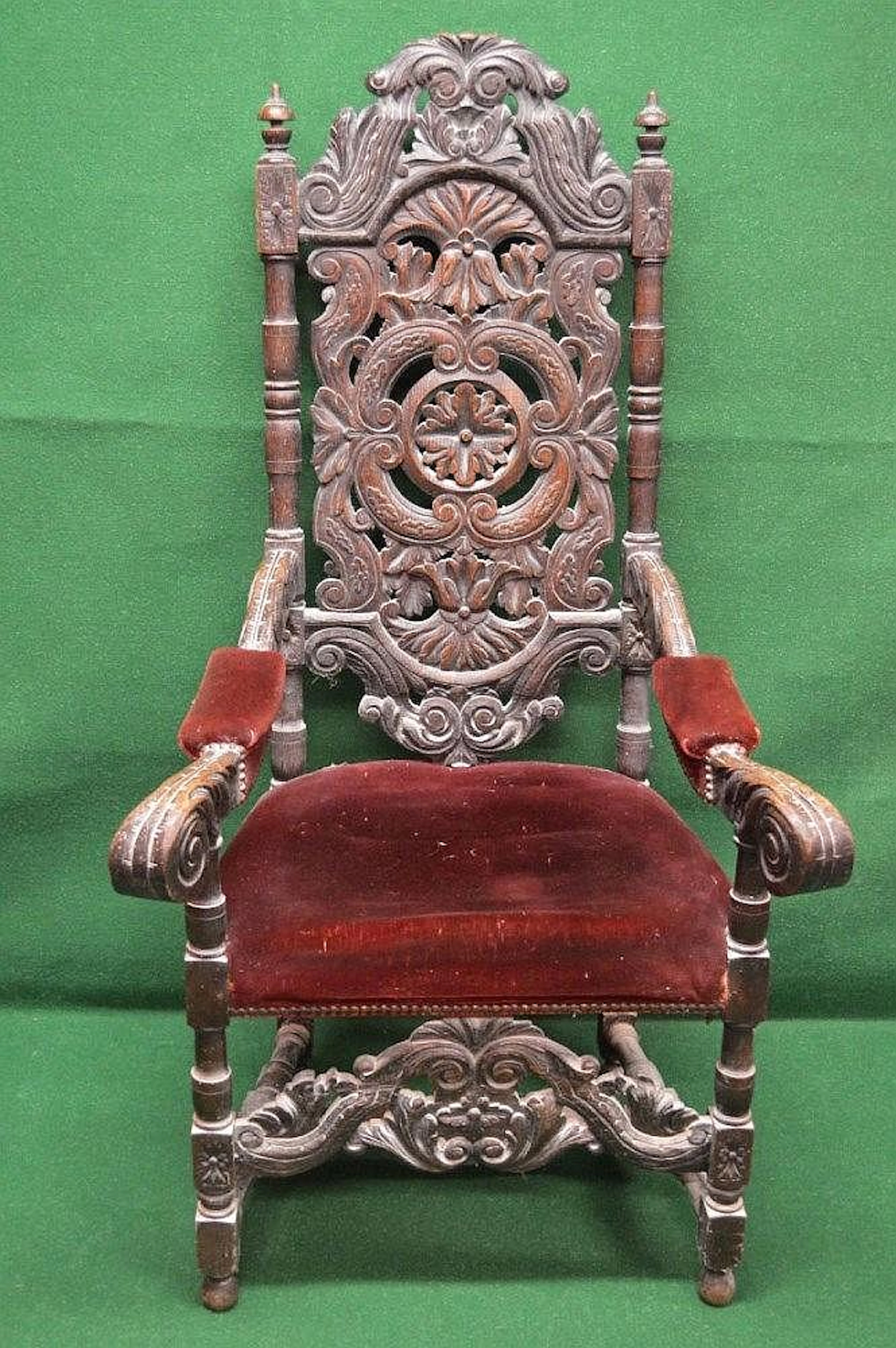 Oak carved high back open armchair having pierced back...