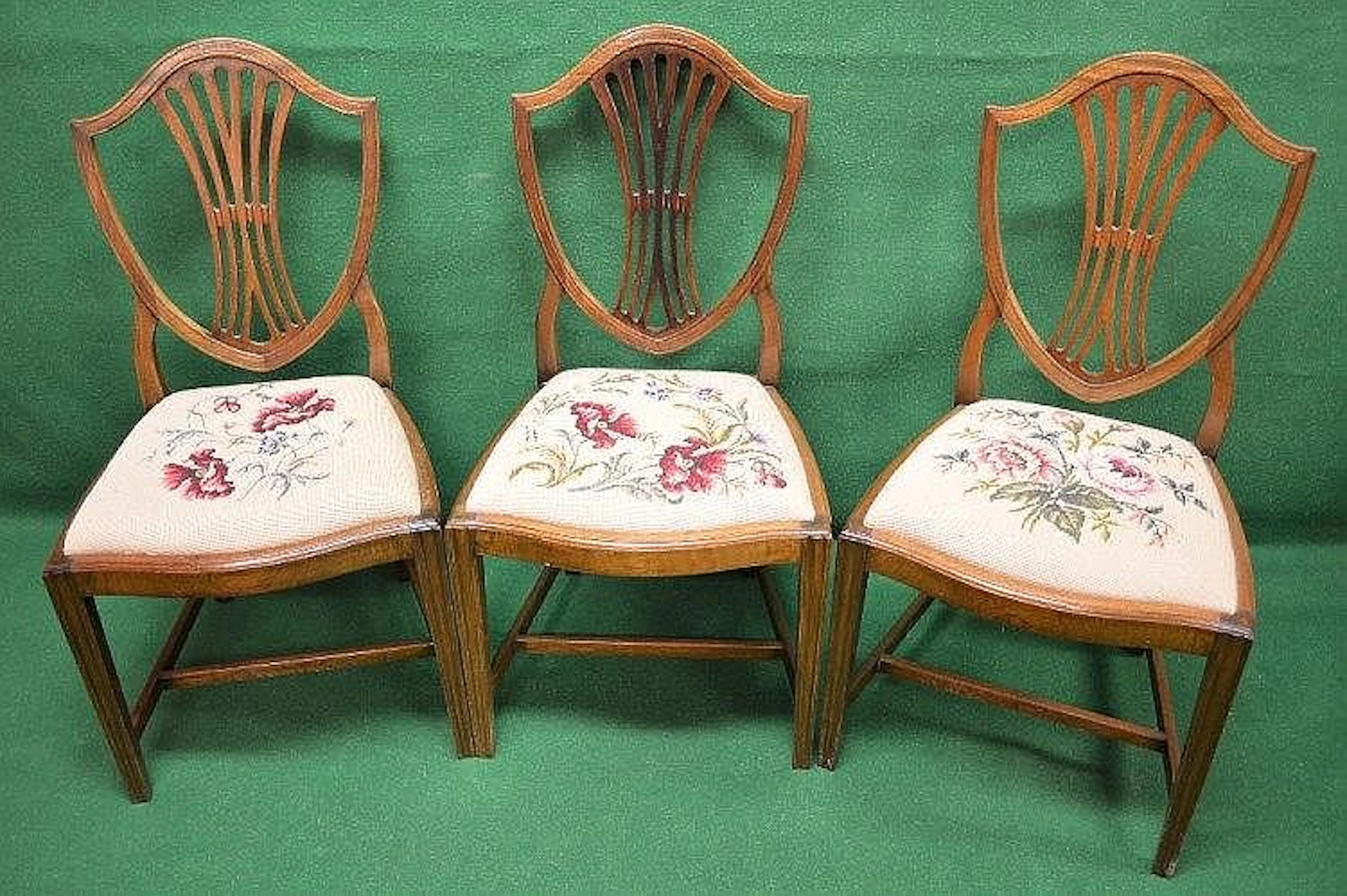 Set of six mahogany shield back dining chairs with tapestry drop in seats