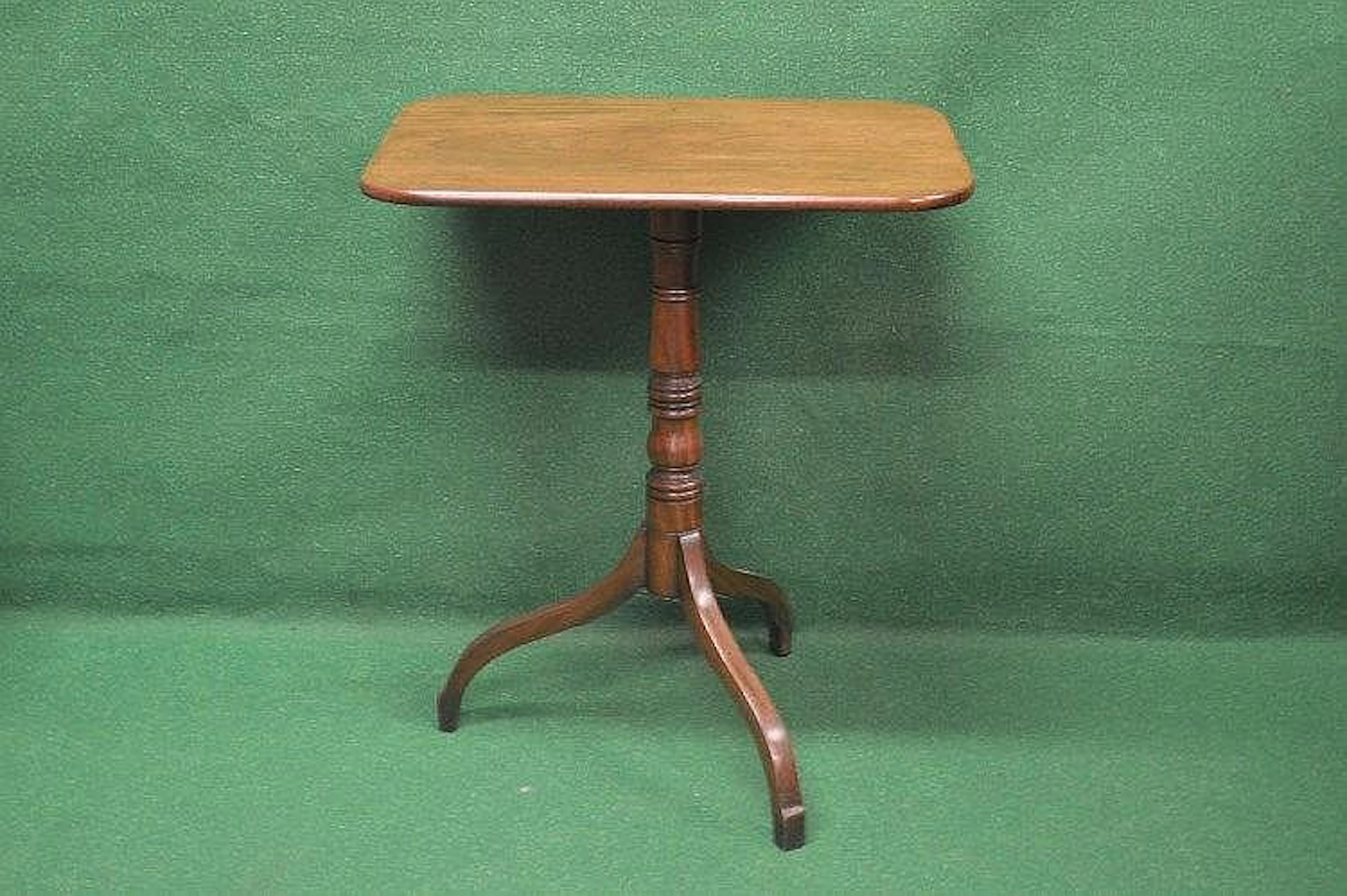 A Georgian mahogany tip top occasional table having...