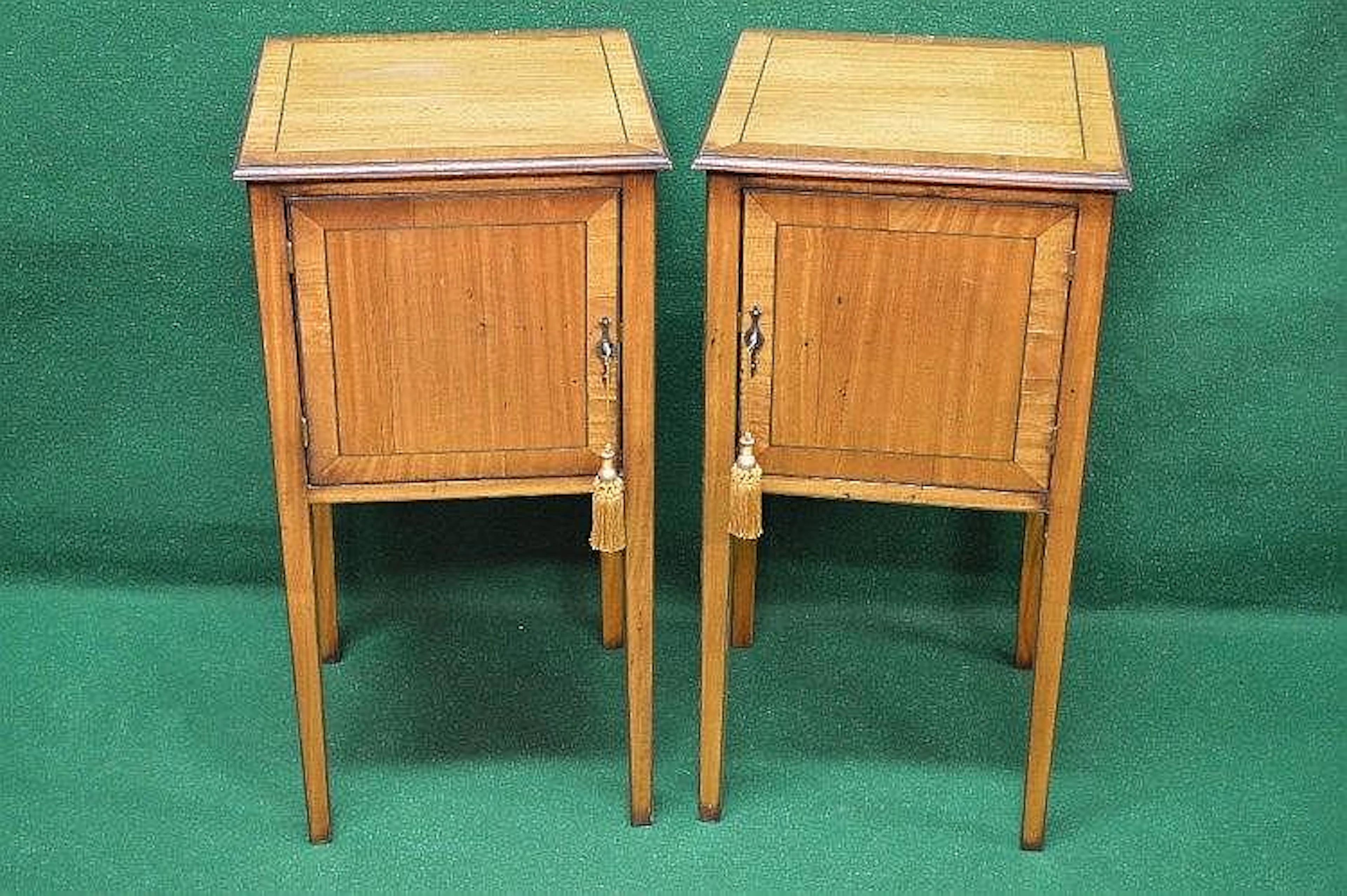 Pair of satinwood cross banded pot cupboards with single...