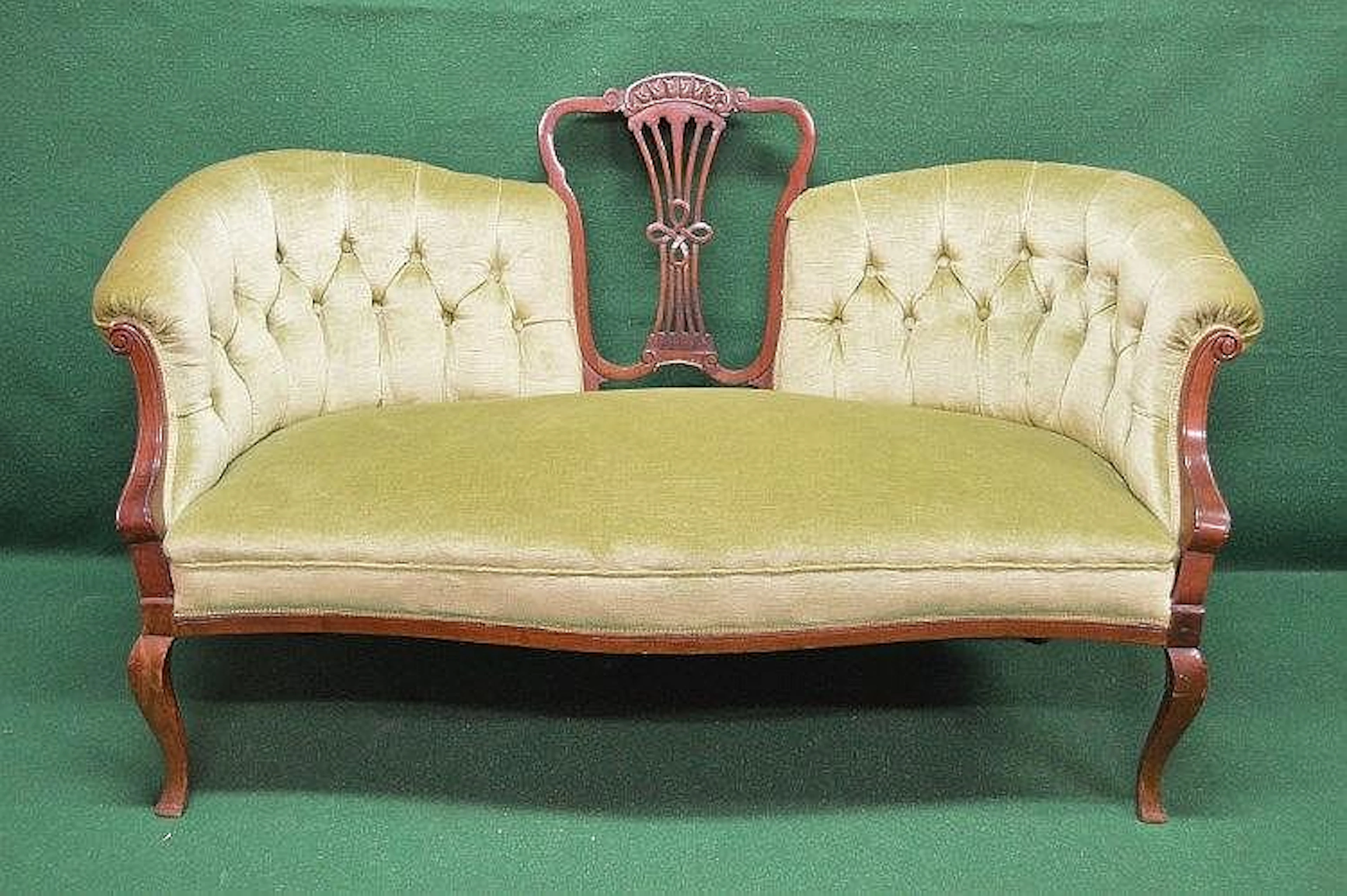 Walnut framed button chair back settee with scrolled arms...