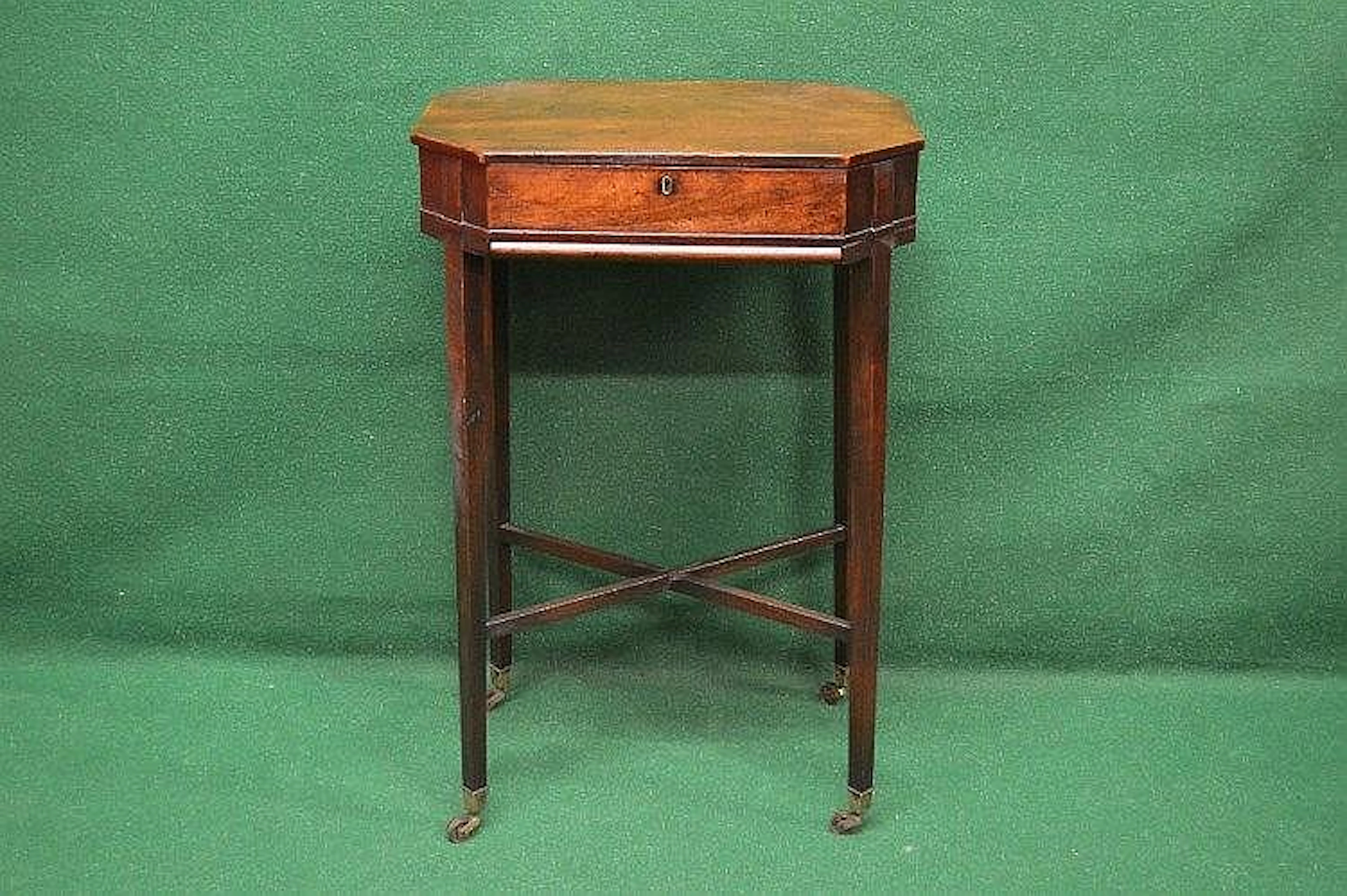 A mahogany rectangular workbox with cut corners