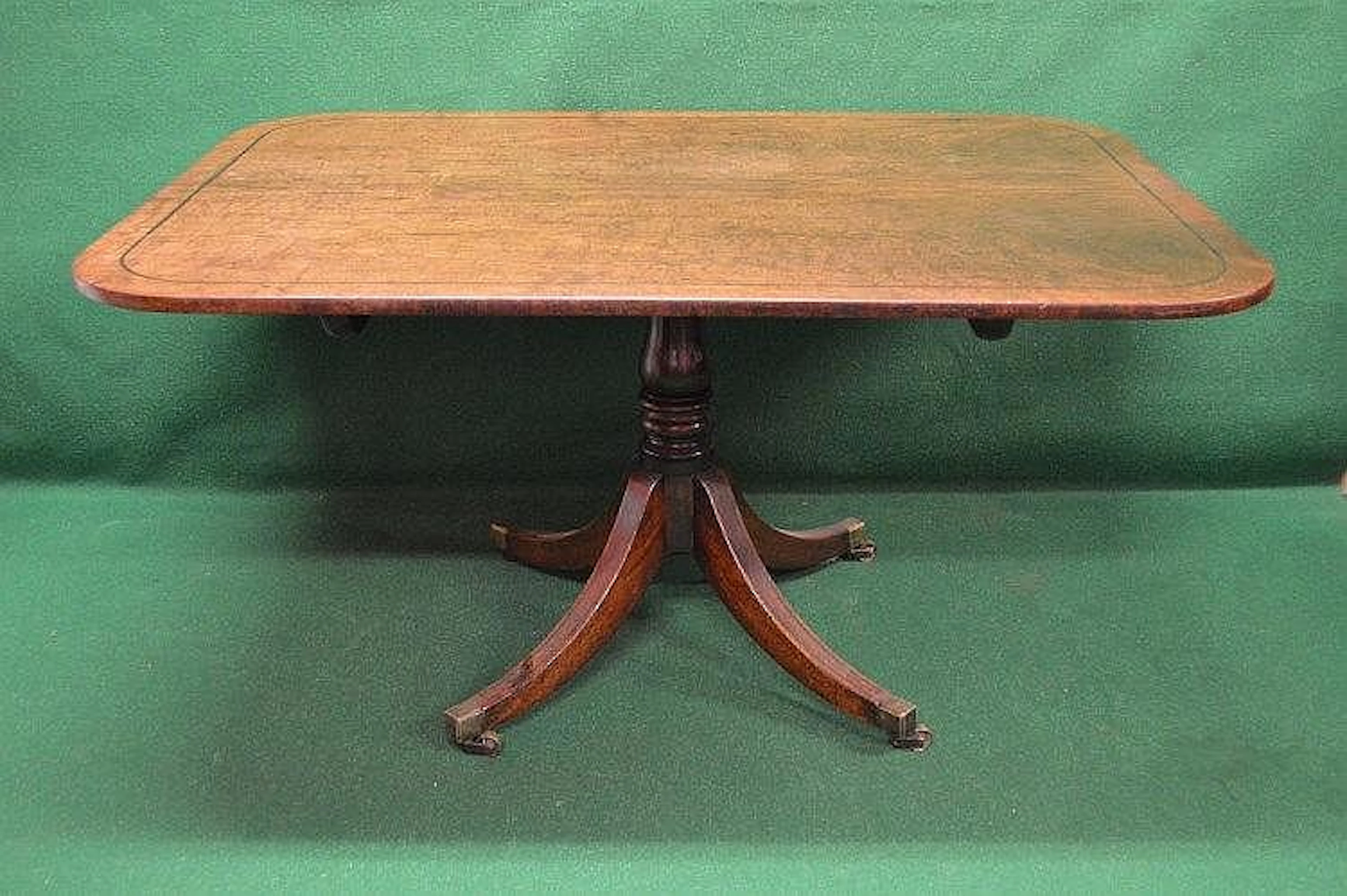 A Regency mahogany breakfast table having string inlaid...