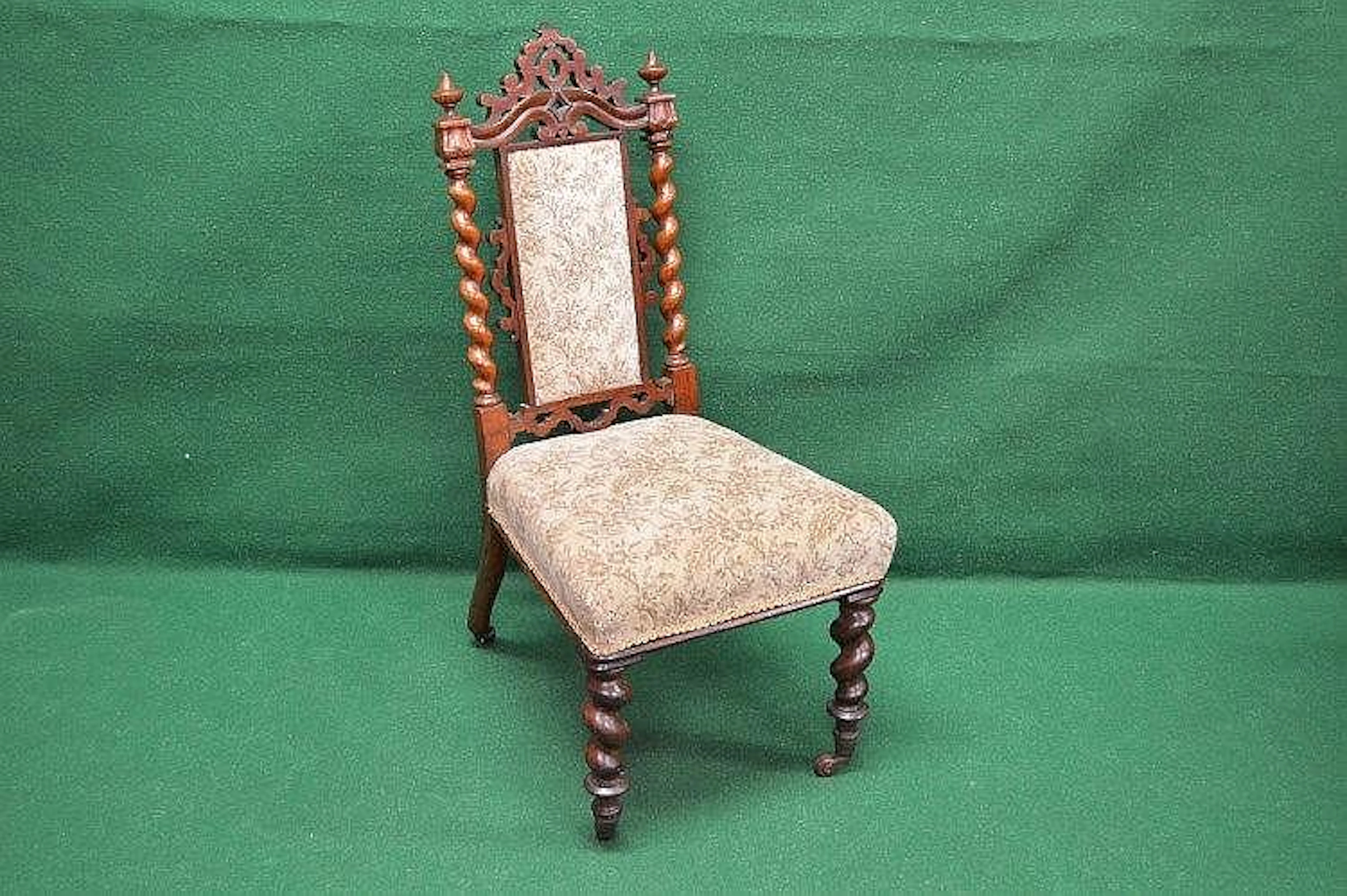 A Victorian rosewood nursing chair having pierced top...