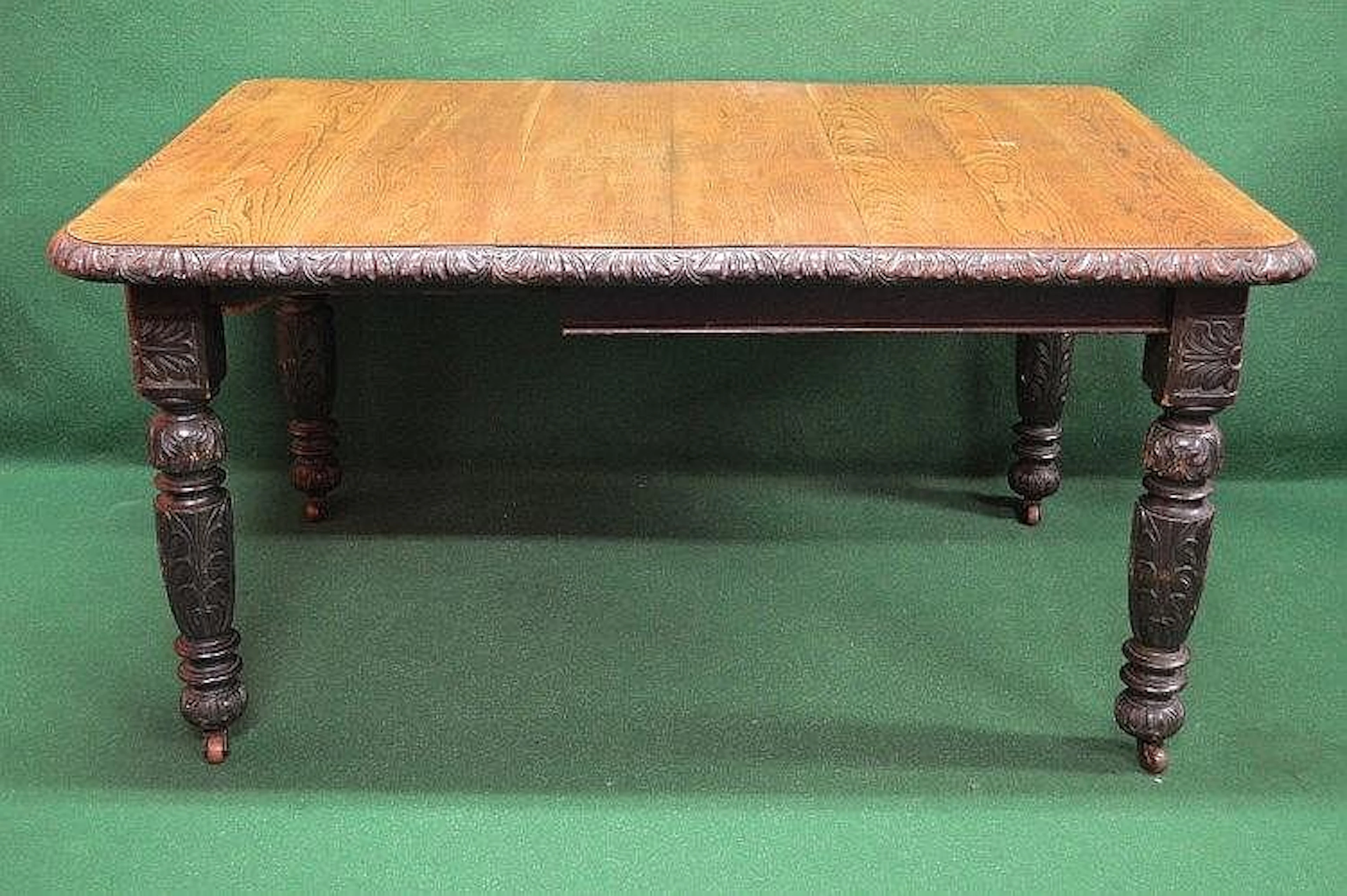 Oak wind out dining table having carved border and...