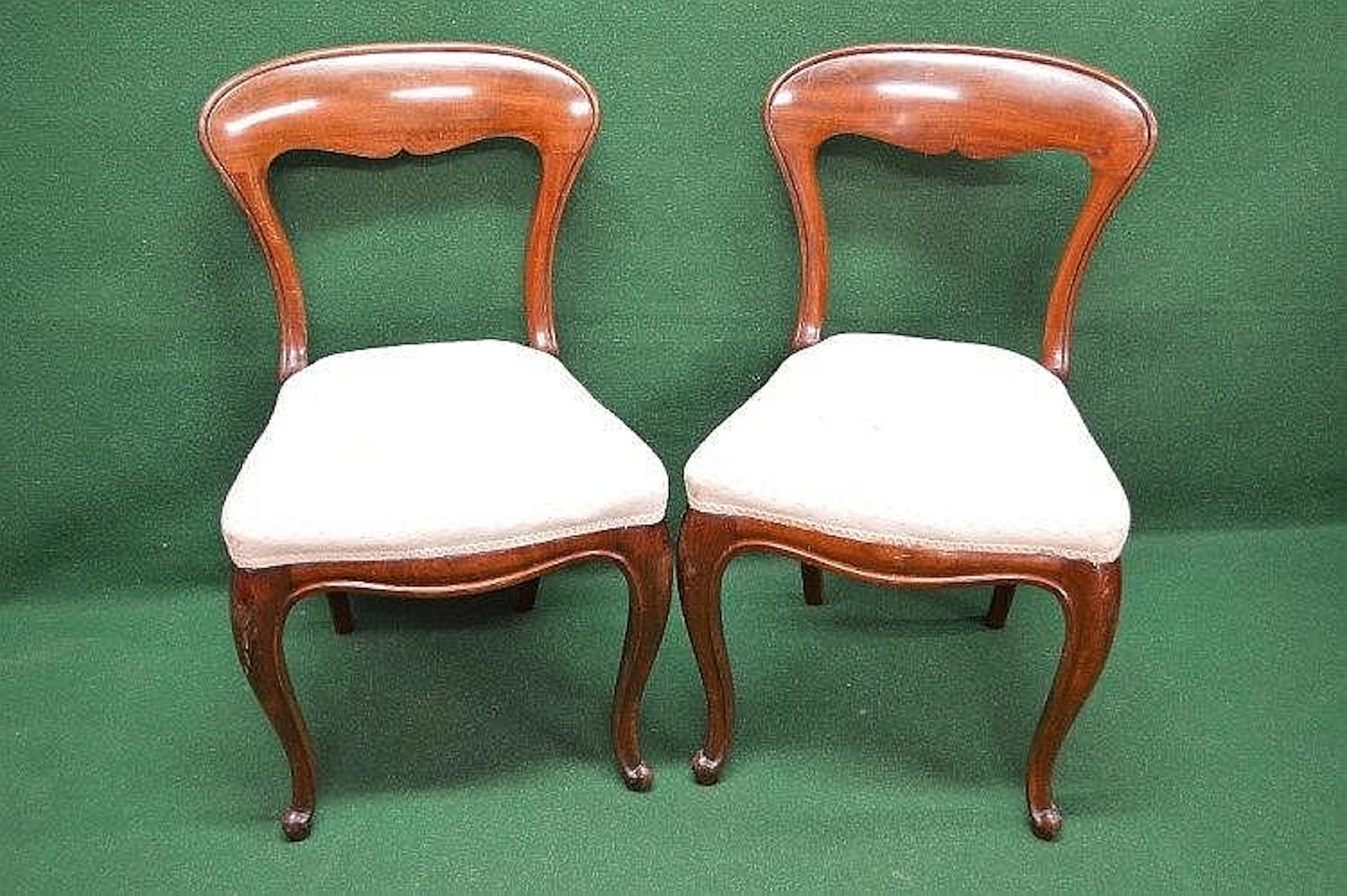 A set of four Victorian mahogany dining chairs with open...
