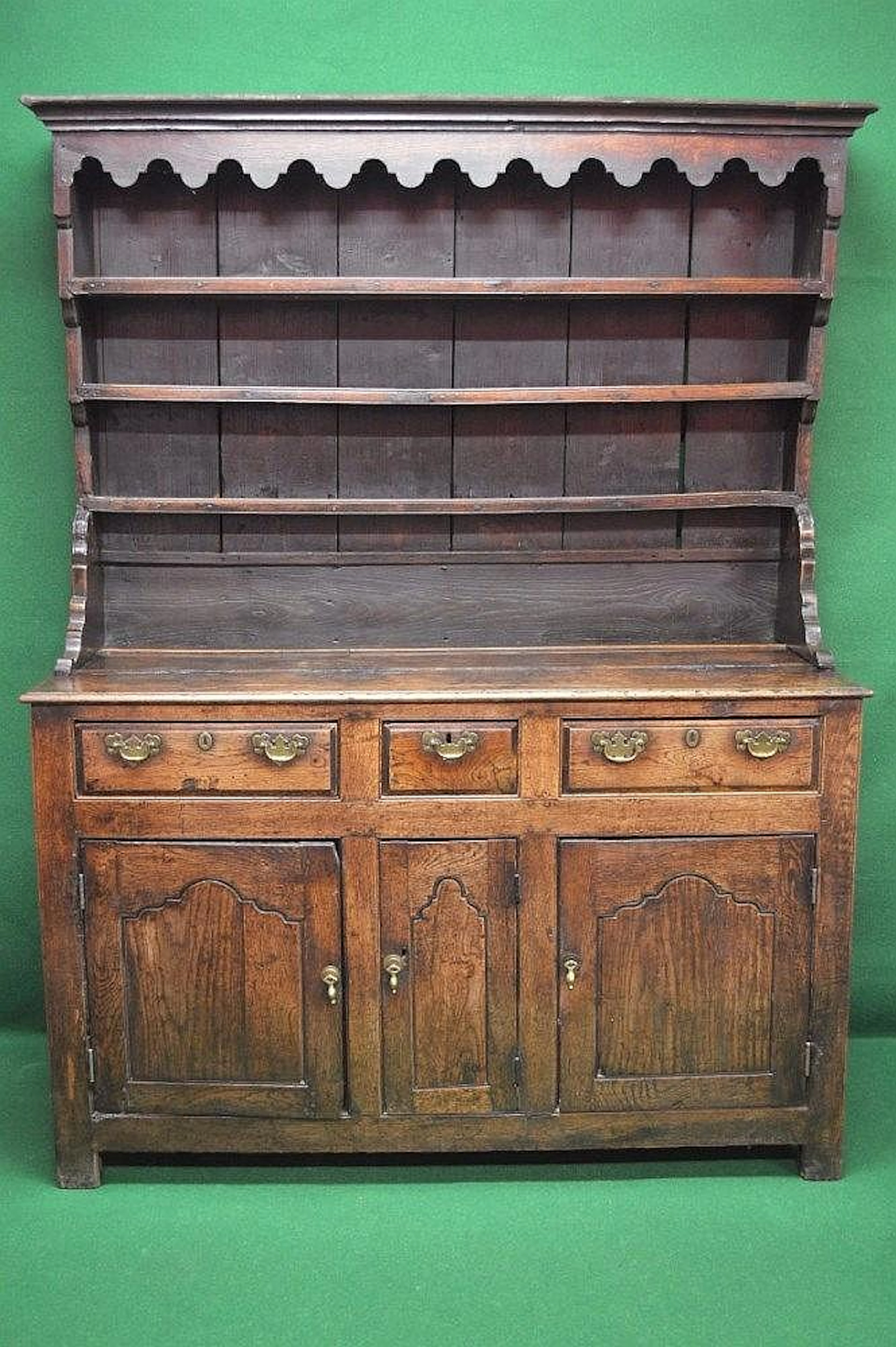 18th century oak dresser with moulded cornice and shaped frieze