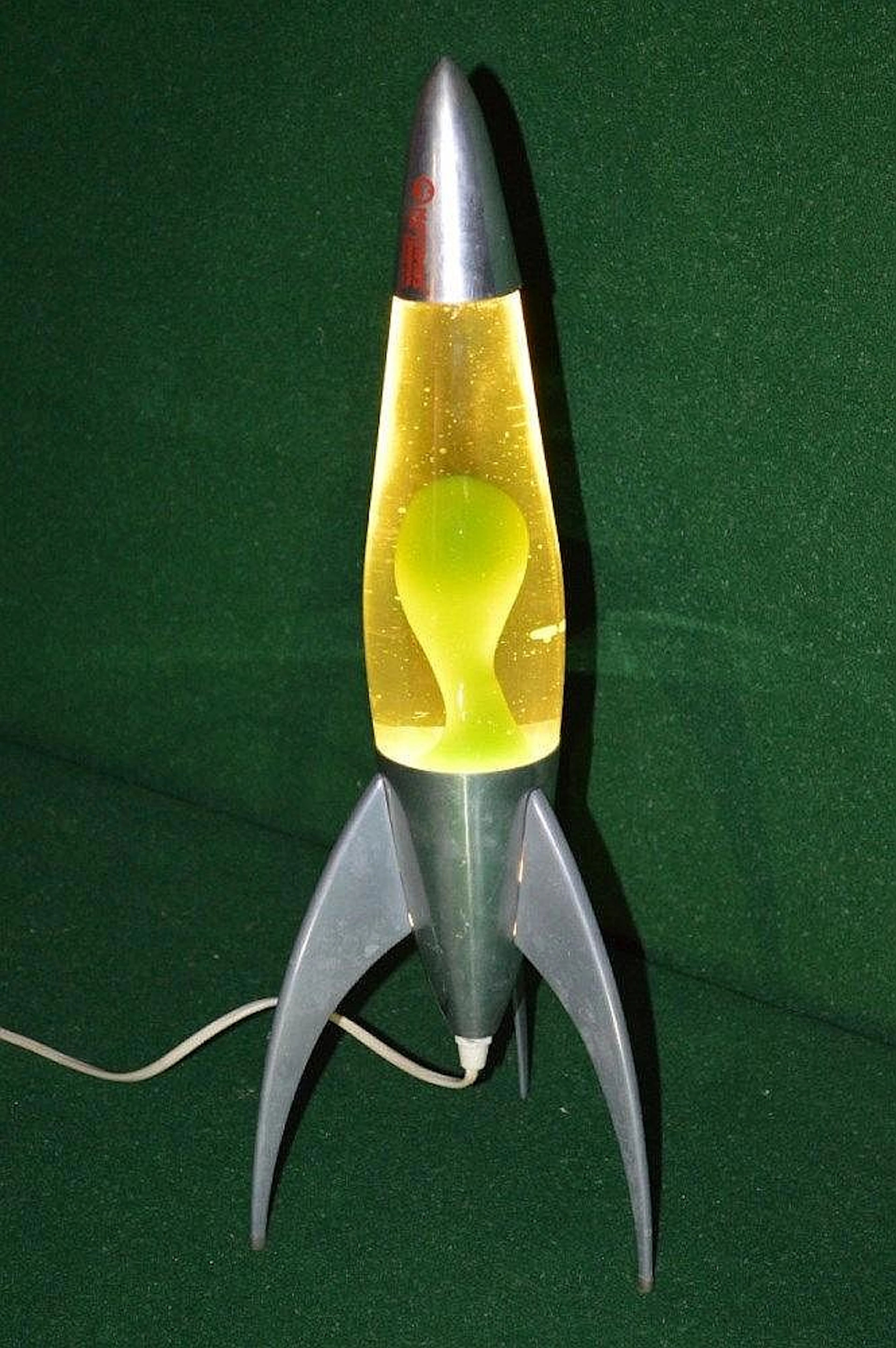 Mathmos rocket form lava lamp having green lava - 20'' tall (working)