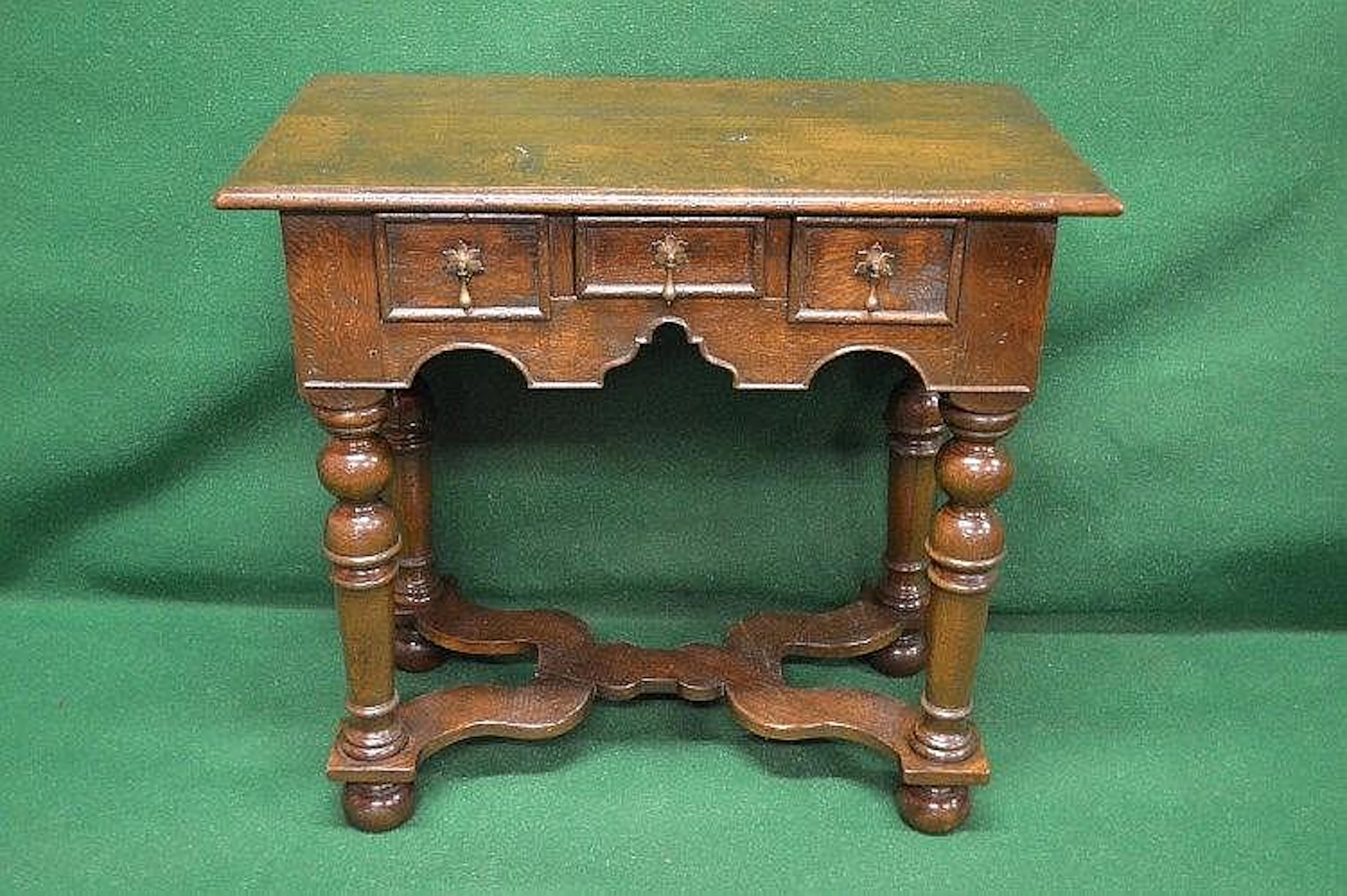 20th century oak lowboy having moulded edge top over...