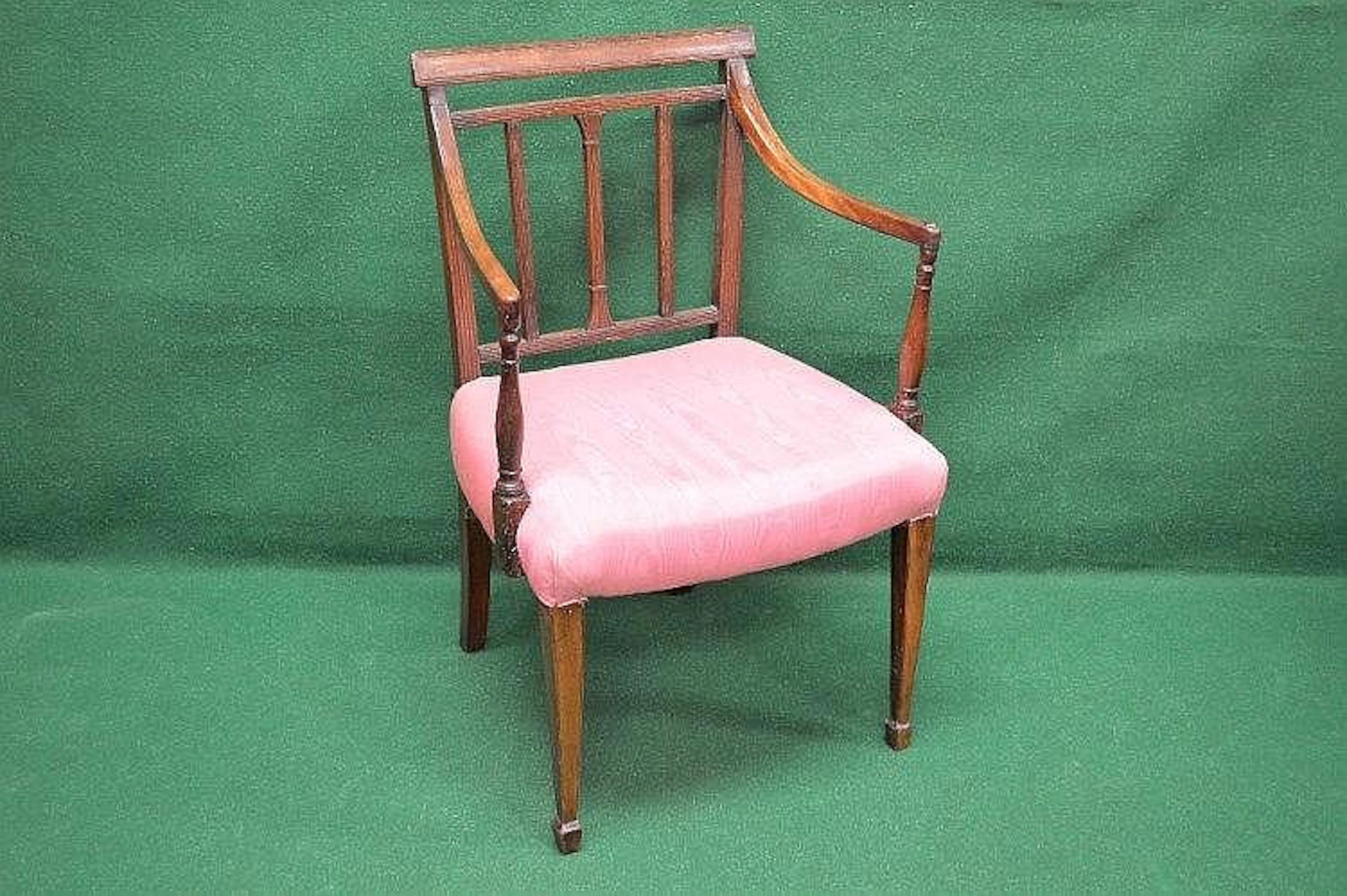 A mahogany open elbow chair having moulded top rail over...