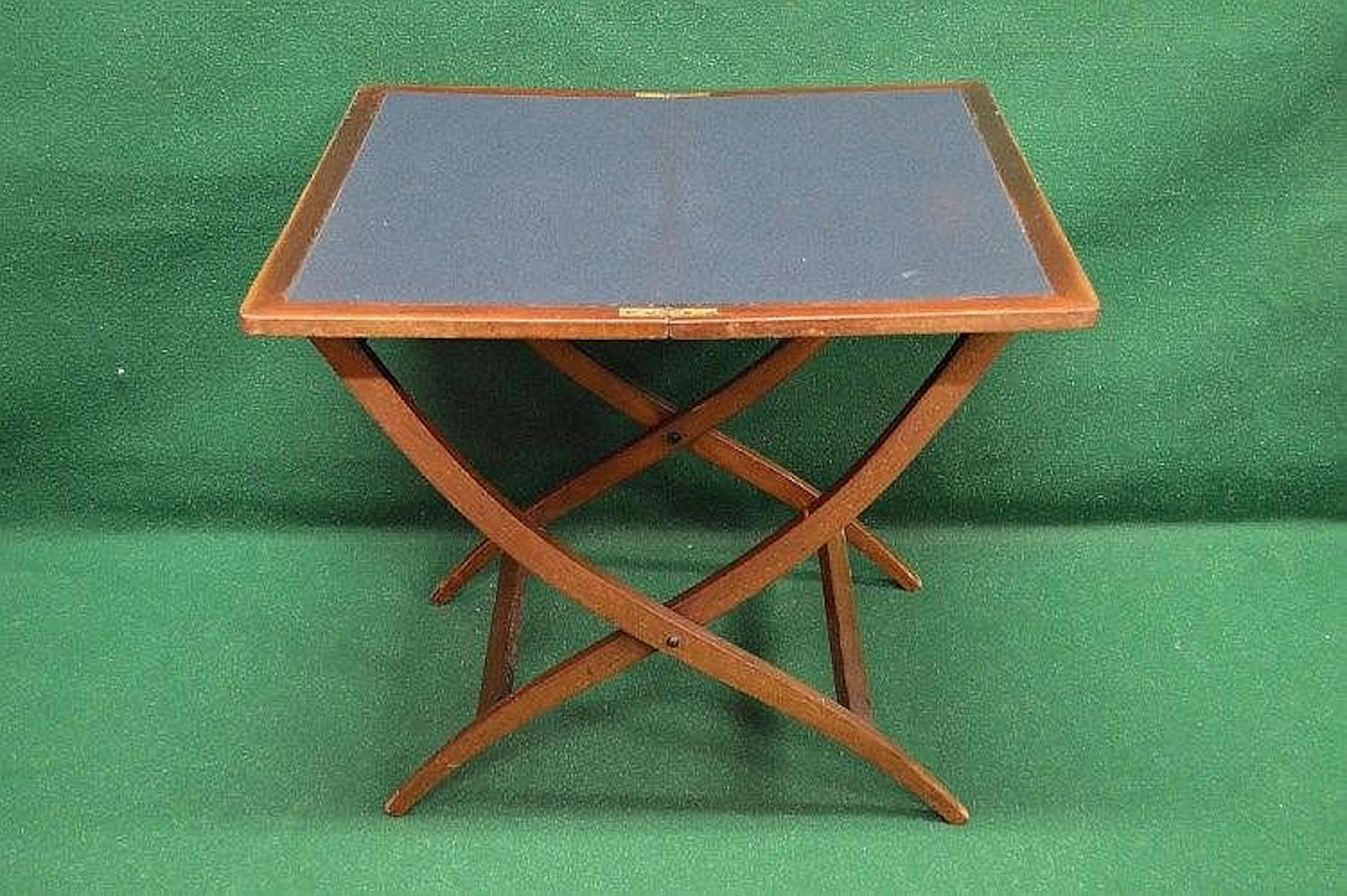 Walnut folding coaching table opening to reveal green baized surface