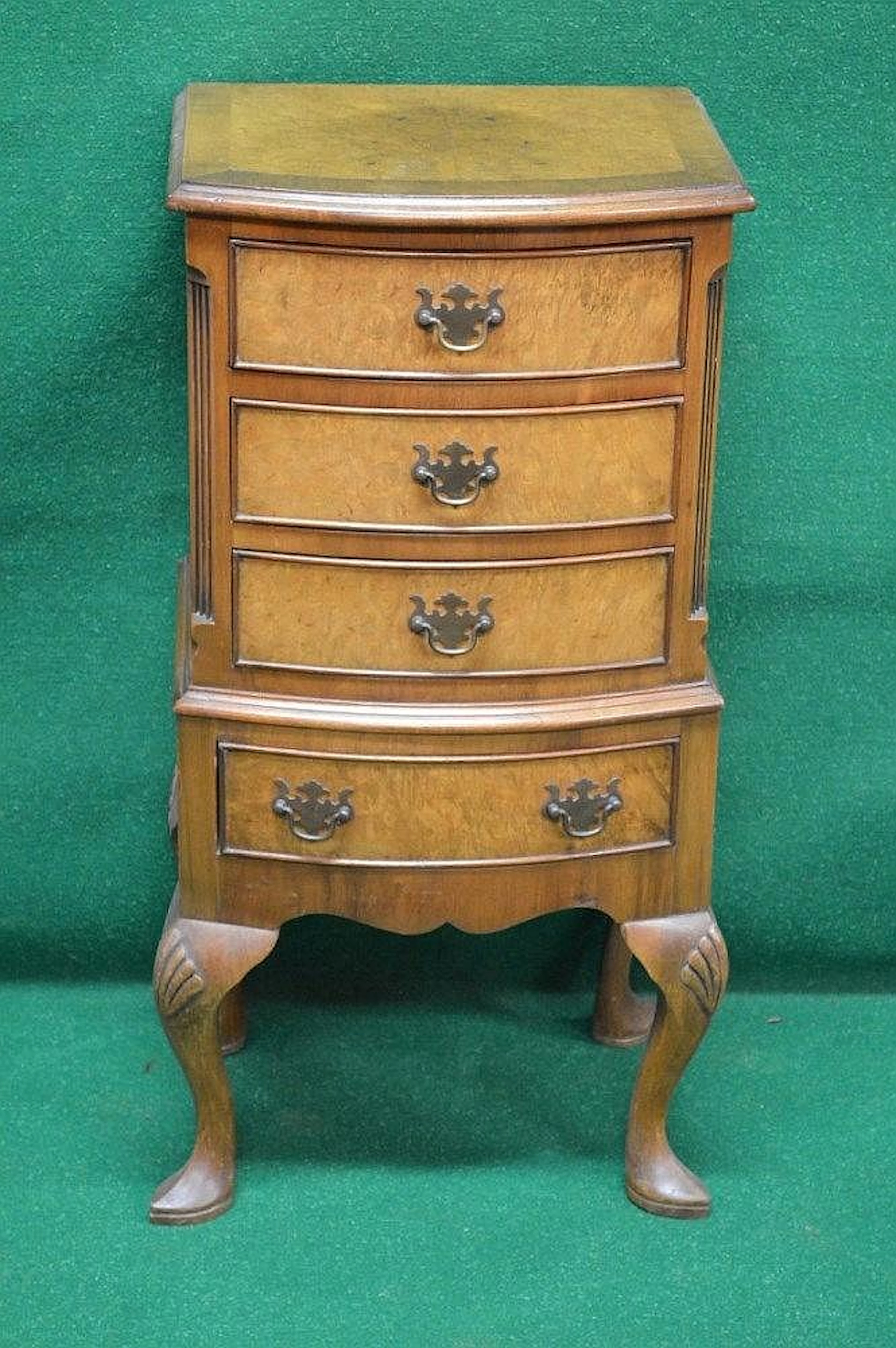 A 20th century miniature burr walnut bow fronted chest on...